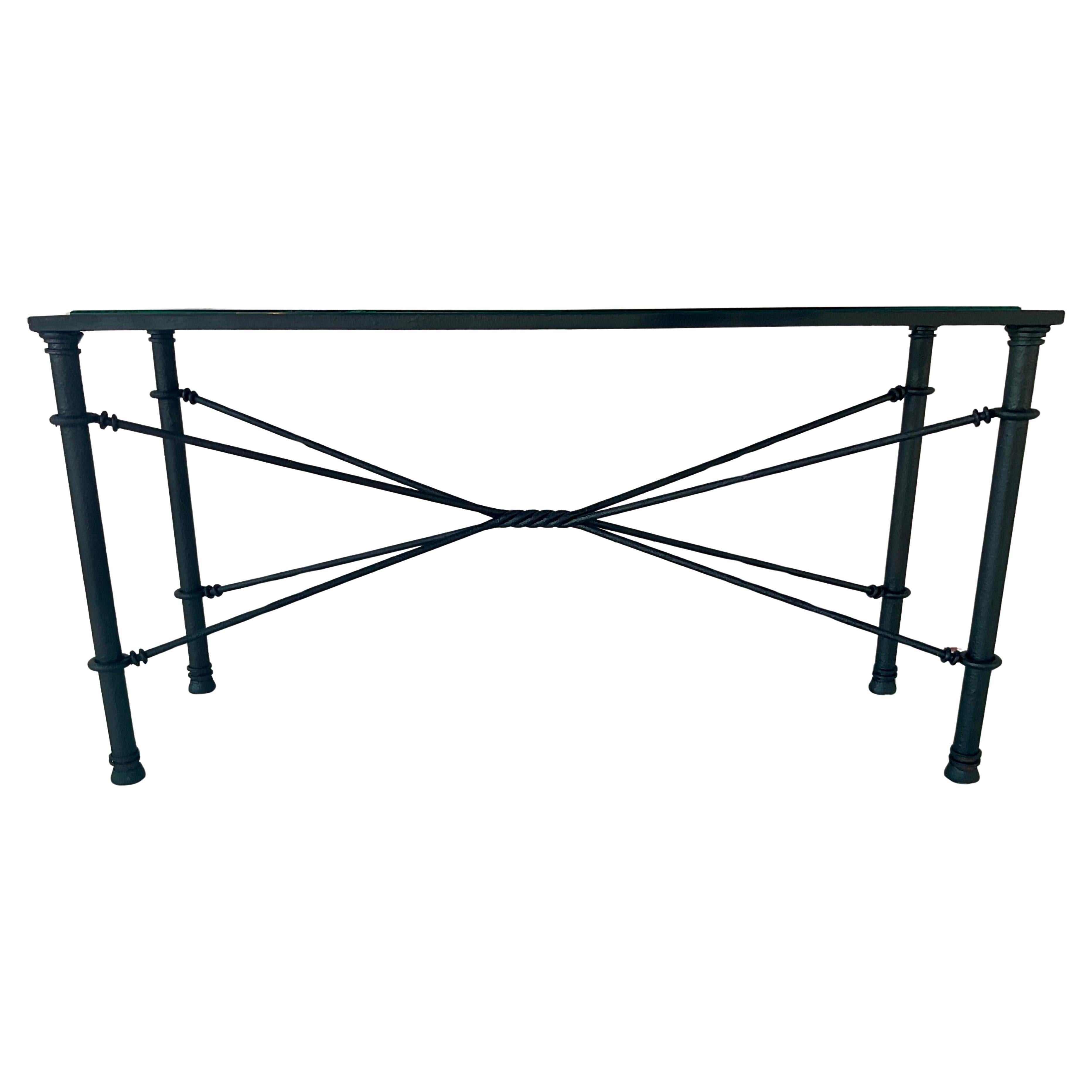 Brutalist Style Black Iron and Glass Console or Sofa Table, circa 1970s, in the style reminiscent of Giacometti. Brutalist furniture, popularized from the 1950s through the 1970s, emphasized raw materials and strong, sculptural forms. Table features