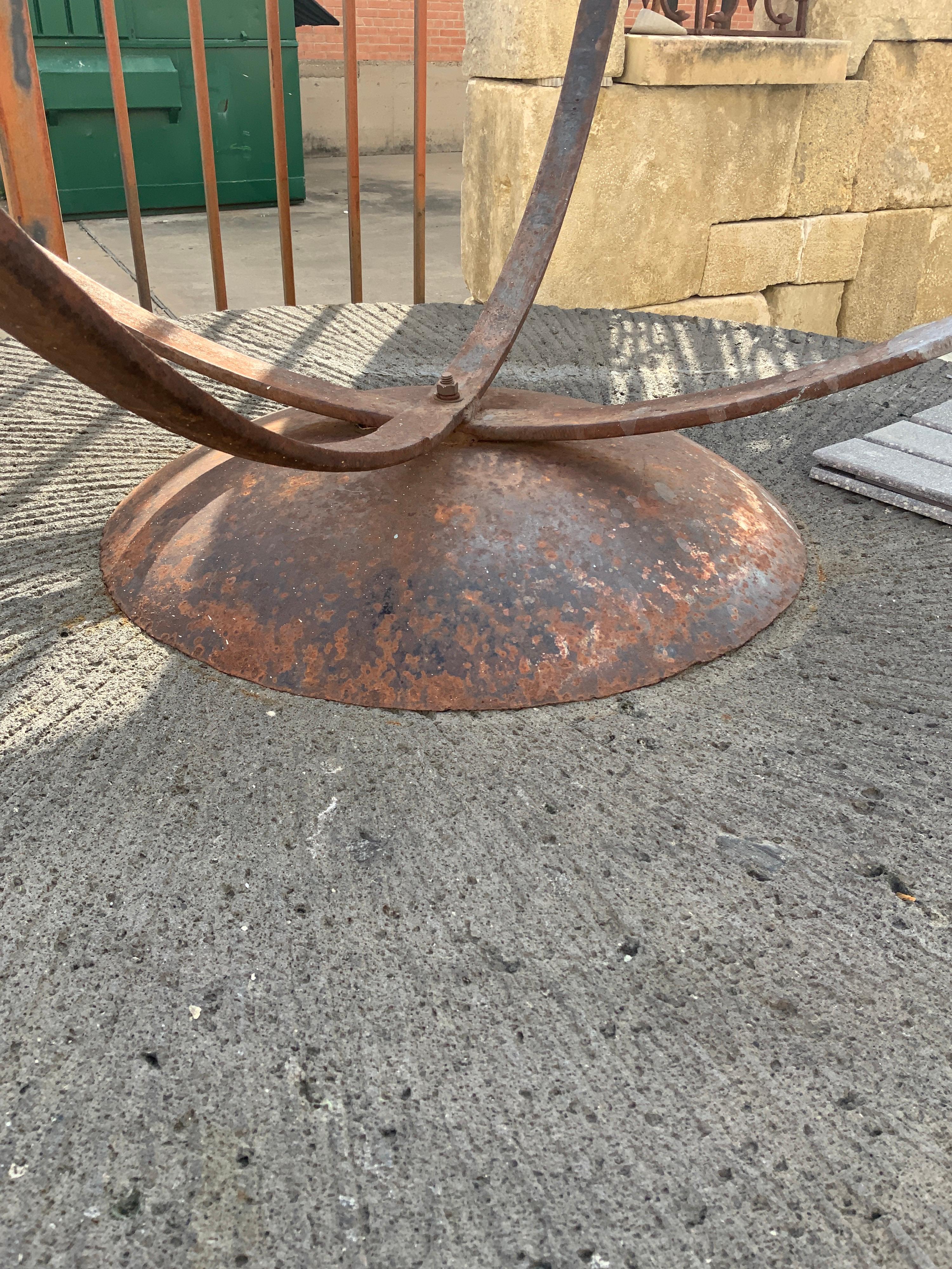 Simple yet stunning very large armillary sphere pierced with an arrow; Iron with bronze finish.