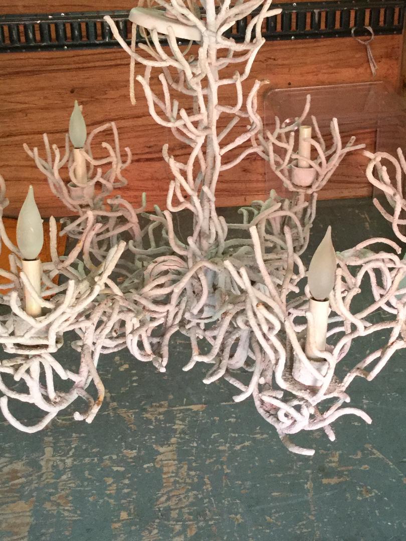 Large iron faux coral chandelier with a white gesso finish. This unusual chandelier has iron branches that come up around the top of the bobeches. This chandelier dates to the 1970s and is wired with a short chain and canopy.


 