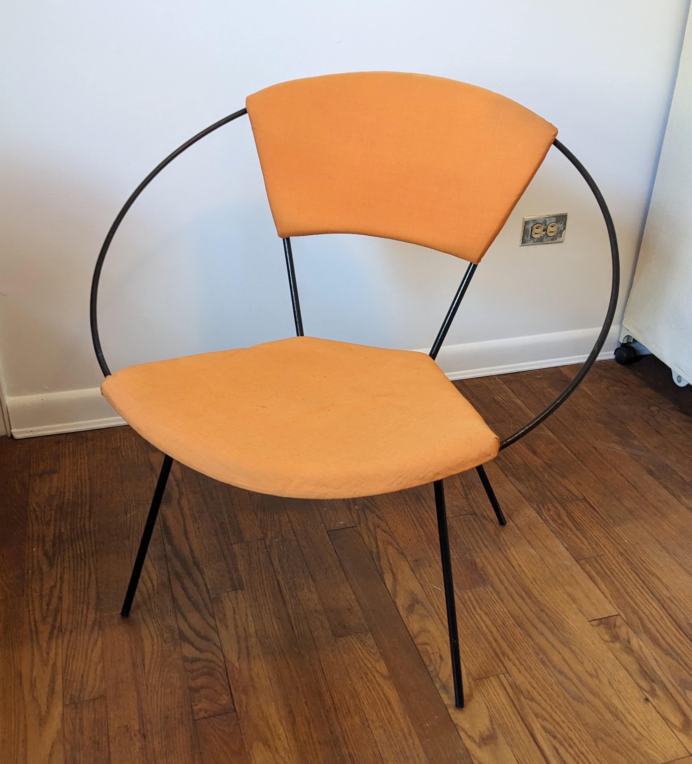 Iconic Mid Century Iron Hoop Chair circa 1950's. Patinaed Wrought Iron in hoop form with foam wedge cushions and sunny orange bias cut cotton/silk textile. Cool aesthetic piece as well as super comfortable. Designed by Joseph Cicchelli for