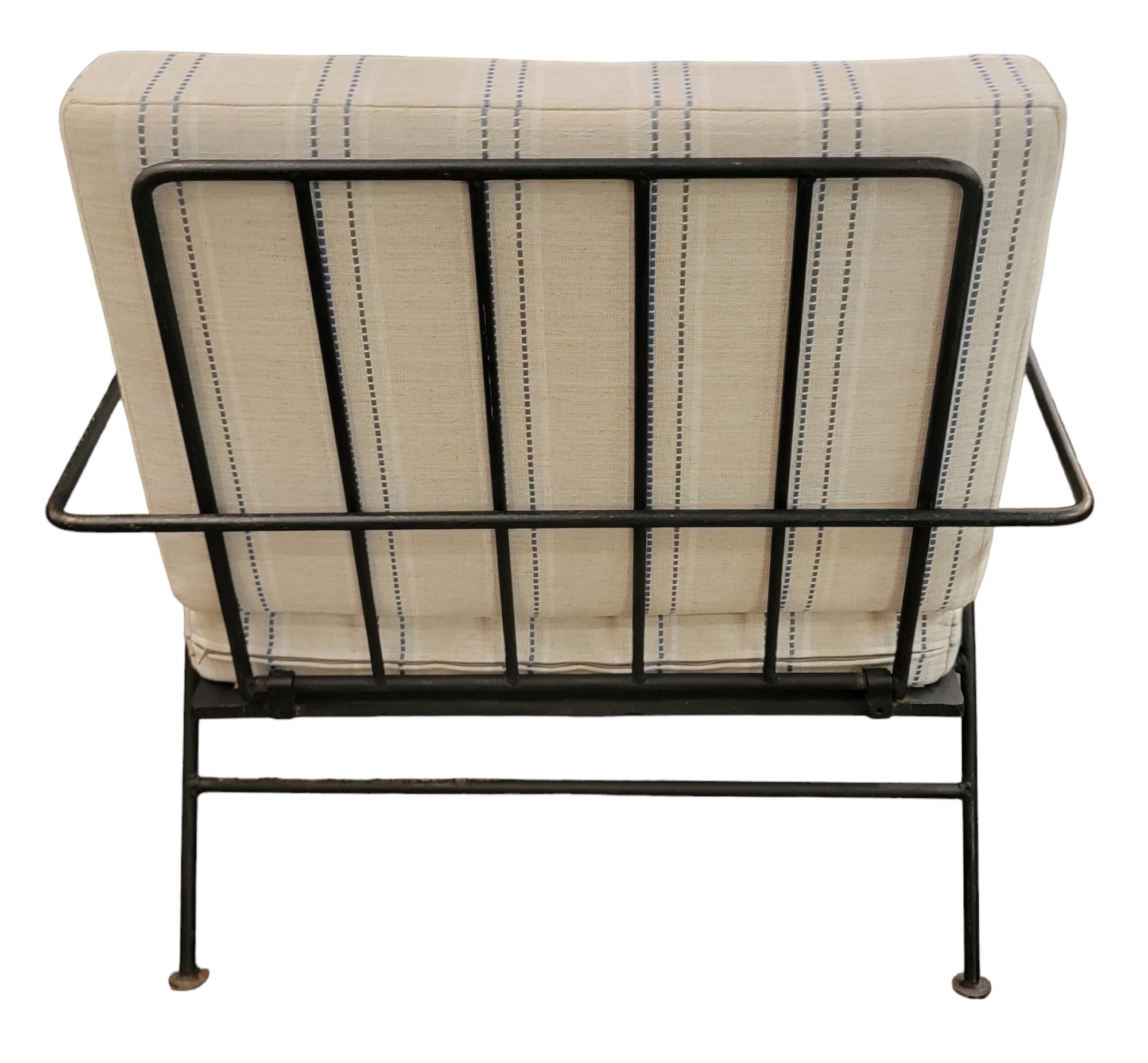 Mid Century Iron Lounge Chair with custom cushion in a blue and strip ticking like material. Great for indoor or outdoor. Back of seat folds in for easier safekeeping/moving. Measures approx - 29w x29d x30.5h seat height 16