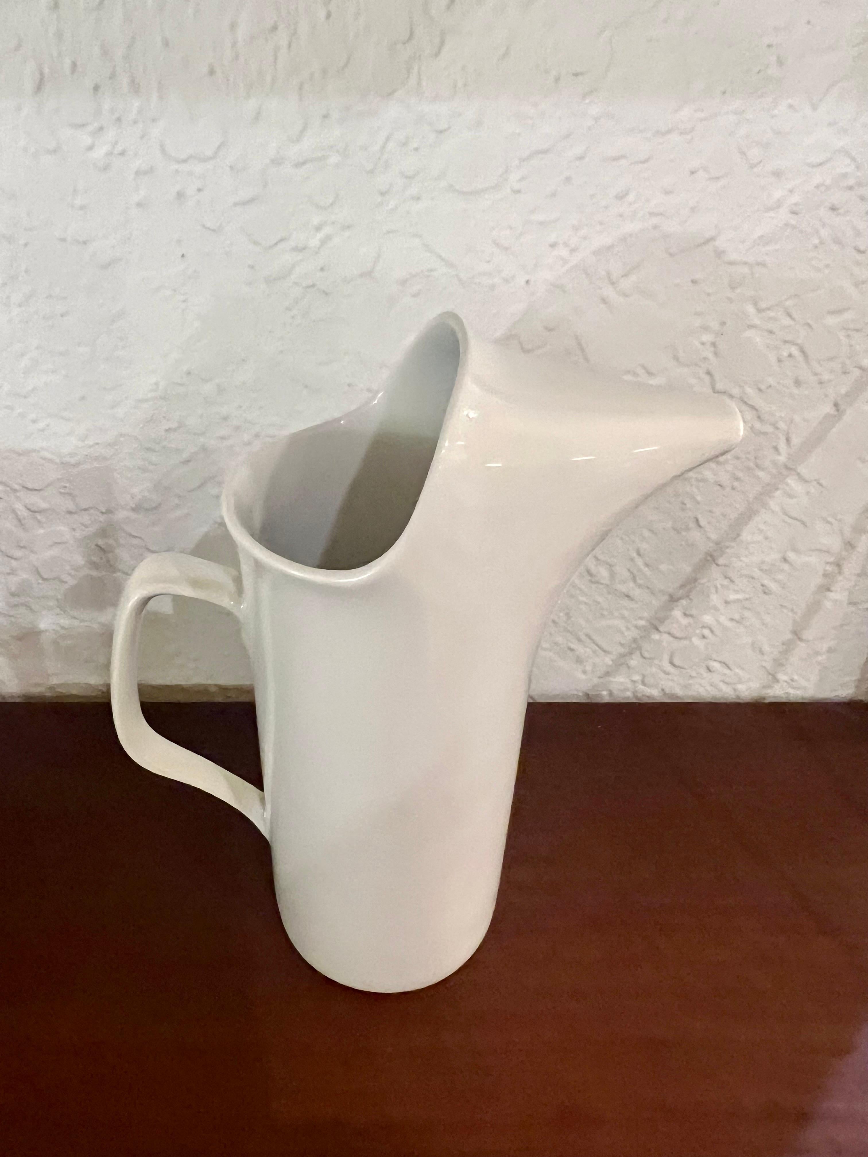 Mid-century modern small ironstone porcelain pitcher (creamer) by Lagardo Tackett for Schmid, circa 1950s. The piece is in very good vintage condition with no chips or cracks.