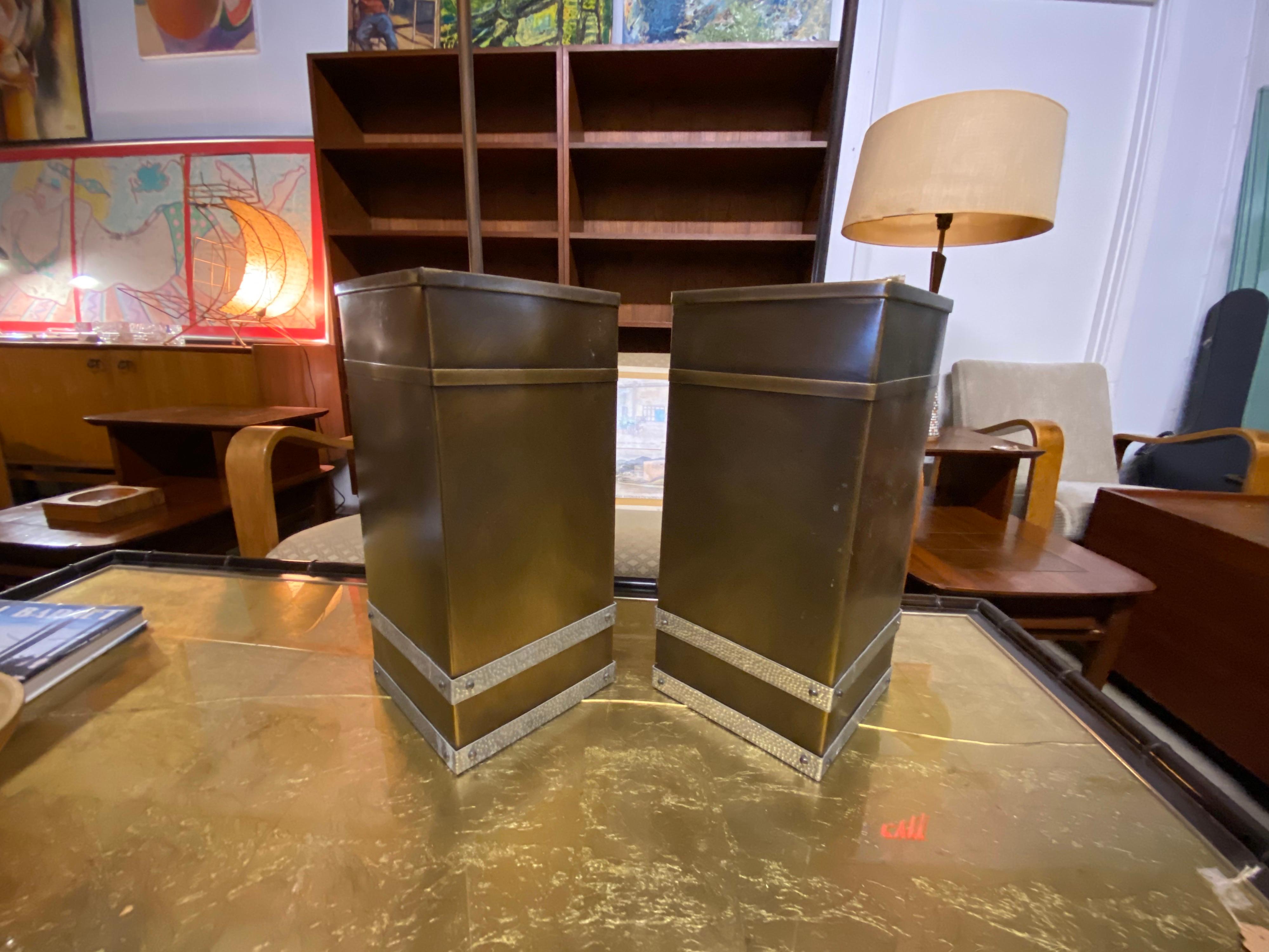 Mid-century metal light fixtures designed by Isaac Maxwell a Texas Architect feature dual tones and fixtures. These are made of brass with hammered metal accent trim. These are in good condition.