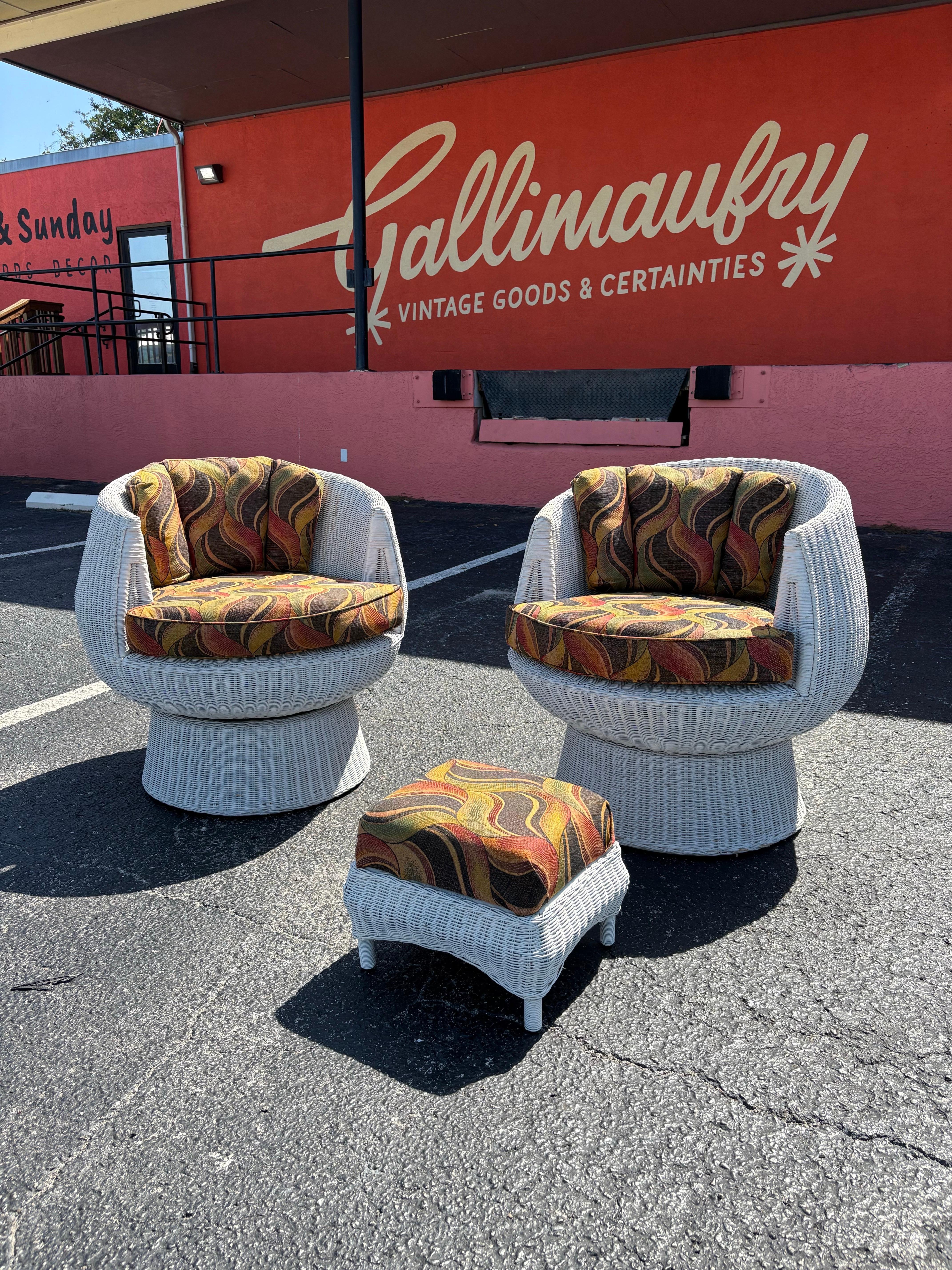 Mid Century White Rattan Wicker Bubble/Mushroom Swivel Lounge Chair Pair with Ottoman in the style of Isamu Kenmochi. White painted rattan swivel chairs with newer custom made patterned seat and back cushions, includes ottoman. Perfect summer