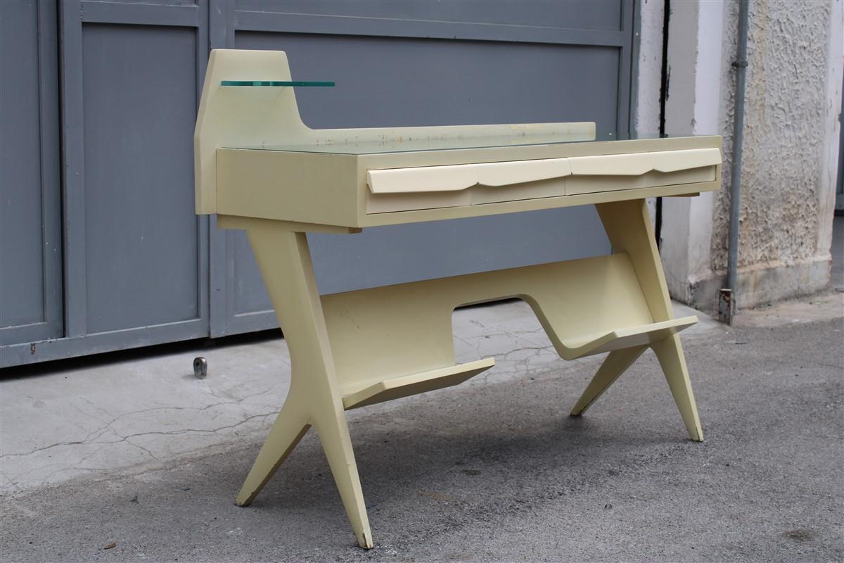 Mid-century Italia vanity desk in lacquered wood and Gio Pont style colored glass.