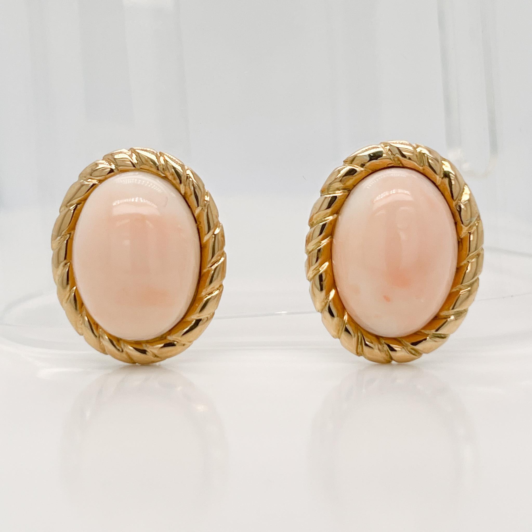 A very fine pair of Mid-Century Italian screw back earrings.

With large smooth oval cabochons framed in 18k gold rope design settings. 

With screwbacks closures to the reverse.

Simply a lovely pair of Mid-Century Italian earrings!

Date:
Mid-20th