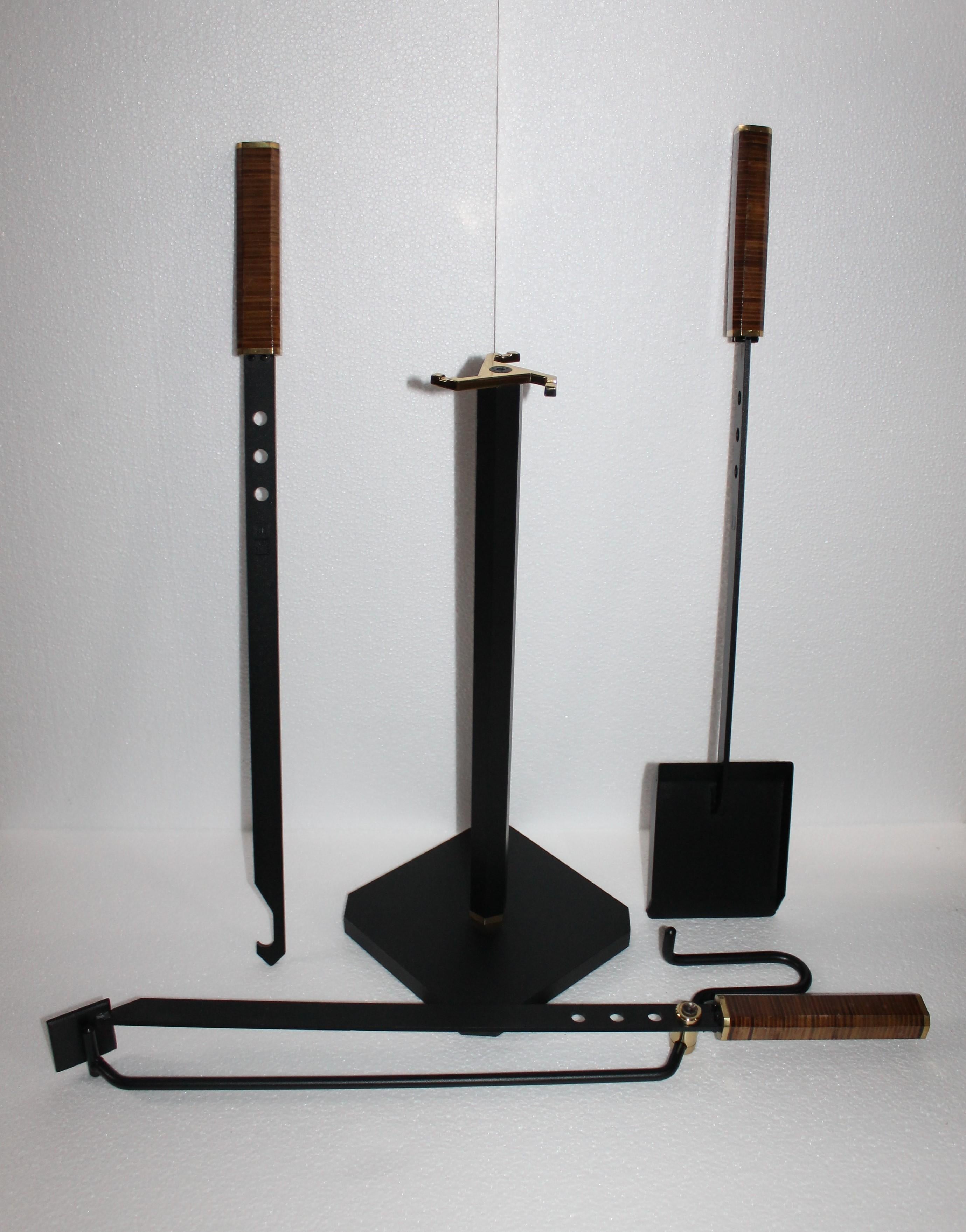 Incredible fireplace tools set by Tobia & Afra Scarpa for Dimensione Fuoco, 1983. Fireplace tools such as shovel, poker and tong in iron with brass details and rosewood handles. These Minimalist showpieces combine tradition, functionality and