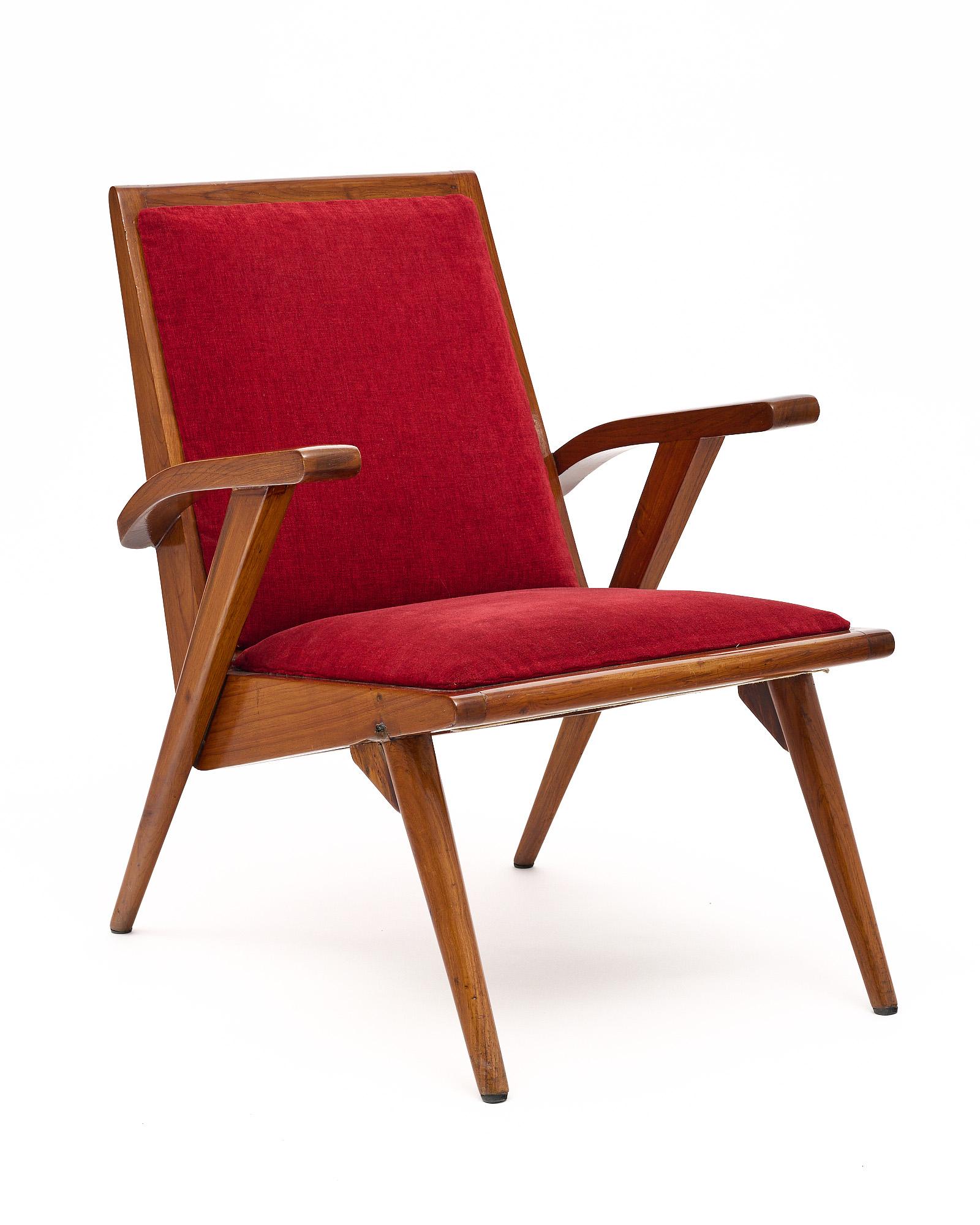 Single armchair from Italy of the mid-century period. We love the strong lines and Italian style of this piece, specifically the craftsmanship of the wood. It has been finished in a lustrous French polish. It is upholstered in the original red