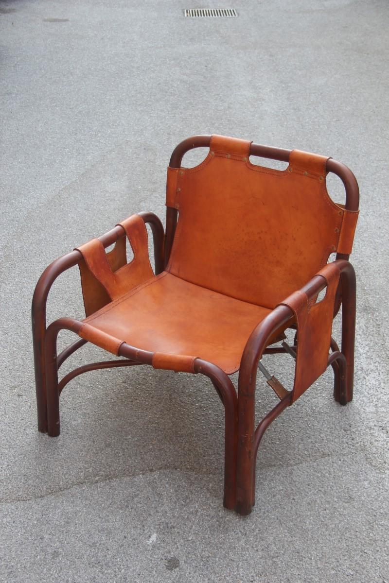 Midcentury Italian rattan armchair in calf leather attributed to Tito Agnoli for Bonacina