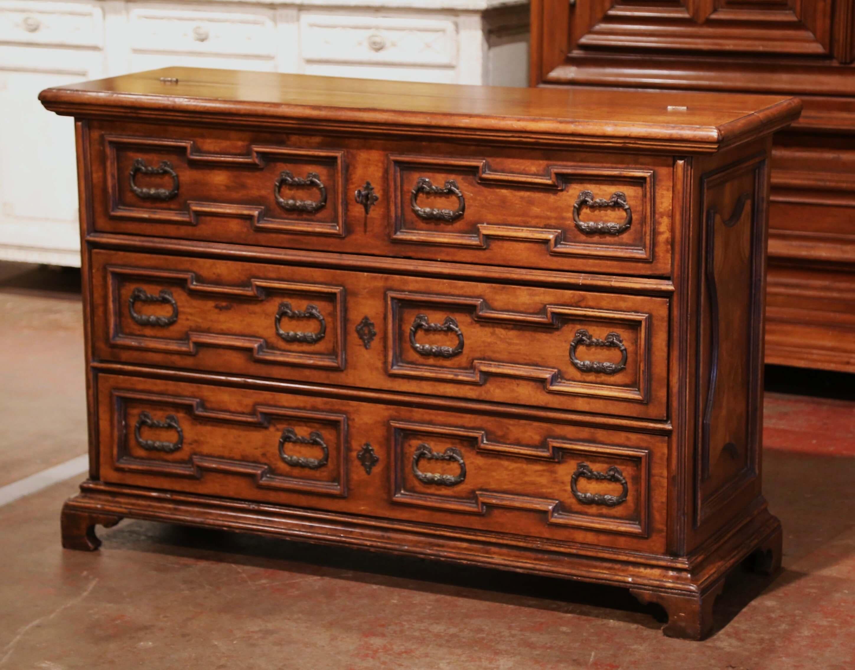 This elegant, multi-function antique chest was created in Italy, circa 1960. Siting on bracket feet over a straight bottom plinth, the fruit wood cabinet features what appears to be three drawers with raised burled panels and dressed with iron