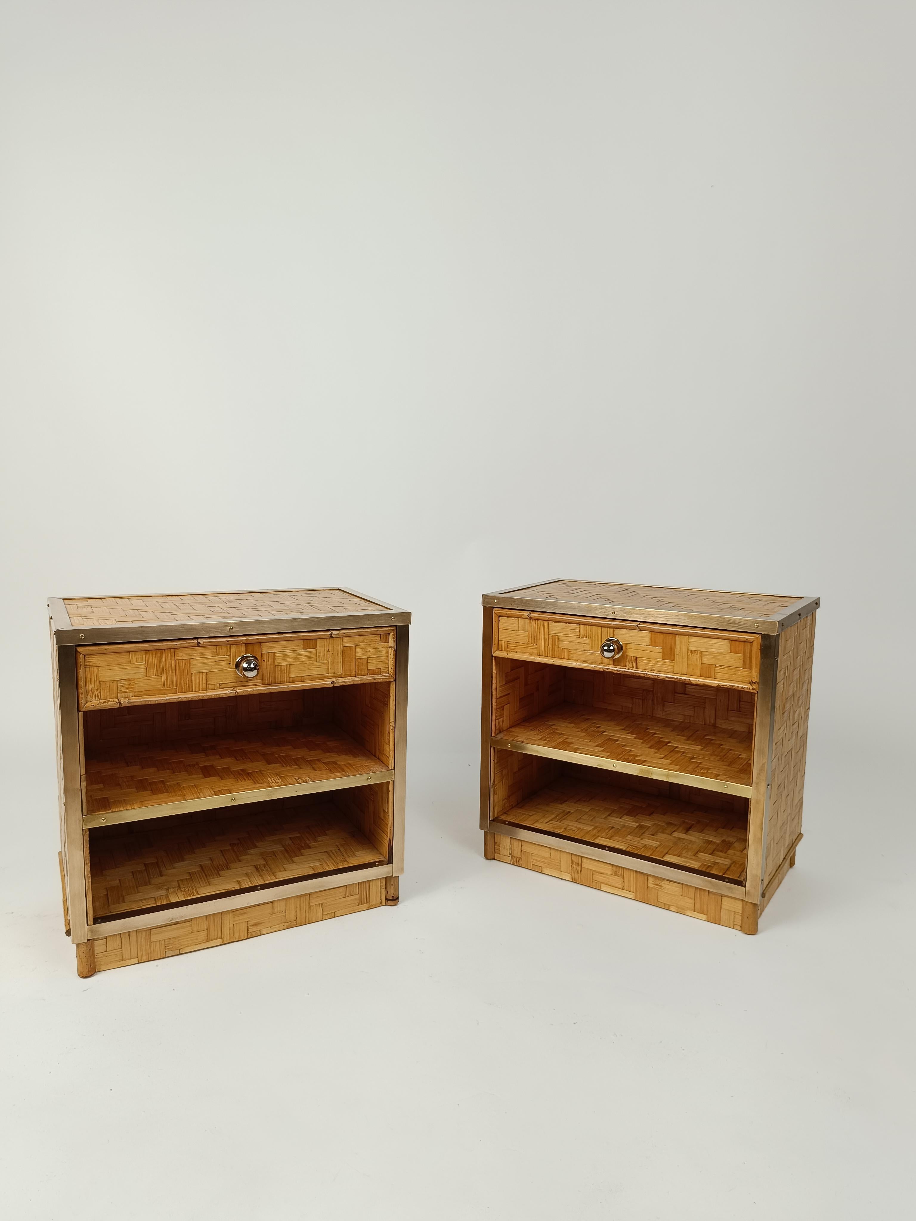 A Pair of midcentury Bedside Table made in Italy between 1960 and 1970.
These Vintage nightstand were made of plywood covered with a dense weave of rattan blocks;
Sections of bamboo sticks and brass details embellish and create glamorous
