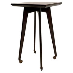 Table de service / table d'appoint italienne noire du milieu du siècle dernier avec plateau en verre rouge, vers 1950