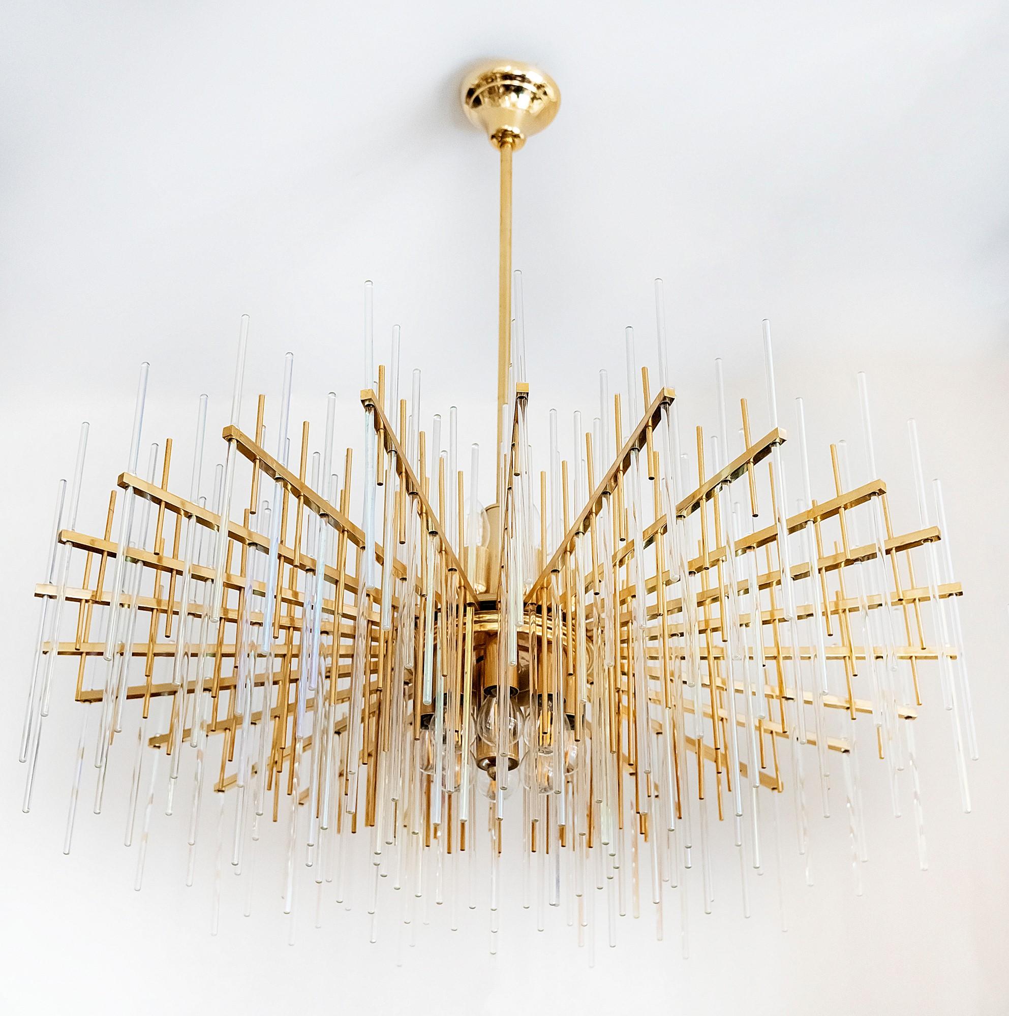 Italian mid-century Sciolari chandelier is made of brass and clear glass in the holders.
This chandelier includes totally 16 pieces of E14 bulbs: 8 up and 8 down.


