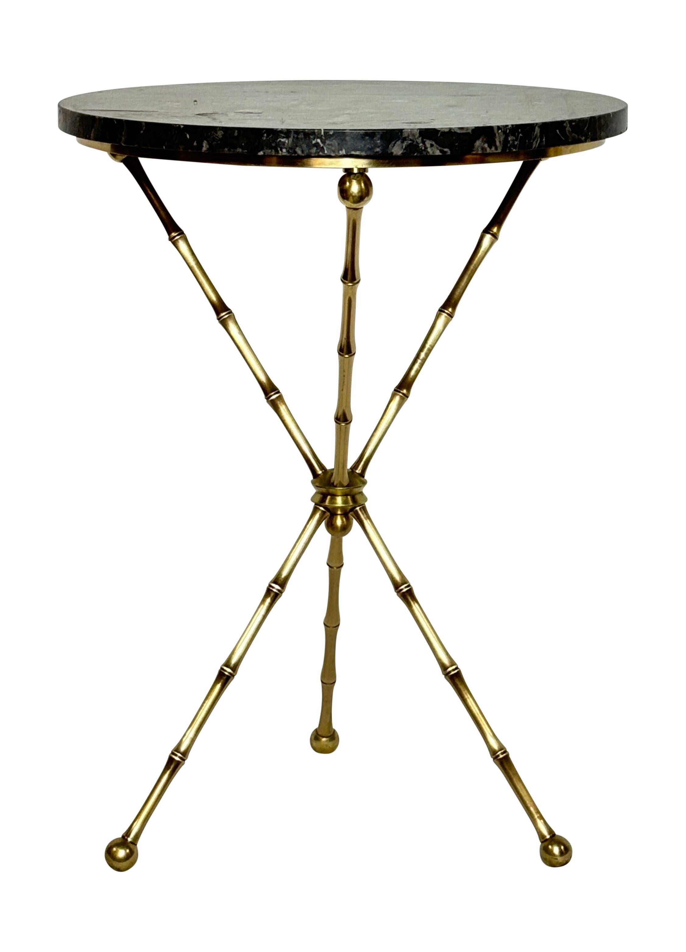 A mid century modern brass side table with marble top.
Italy, 1960's.