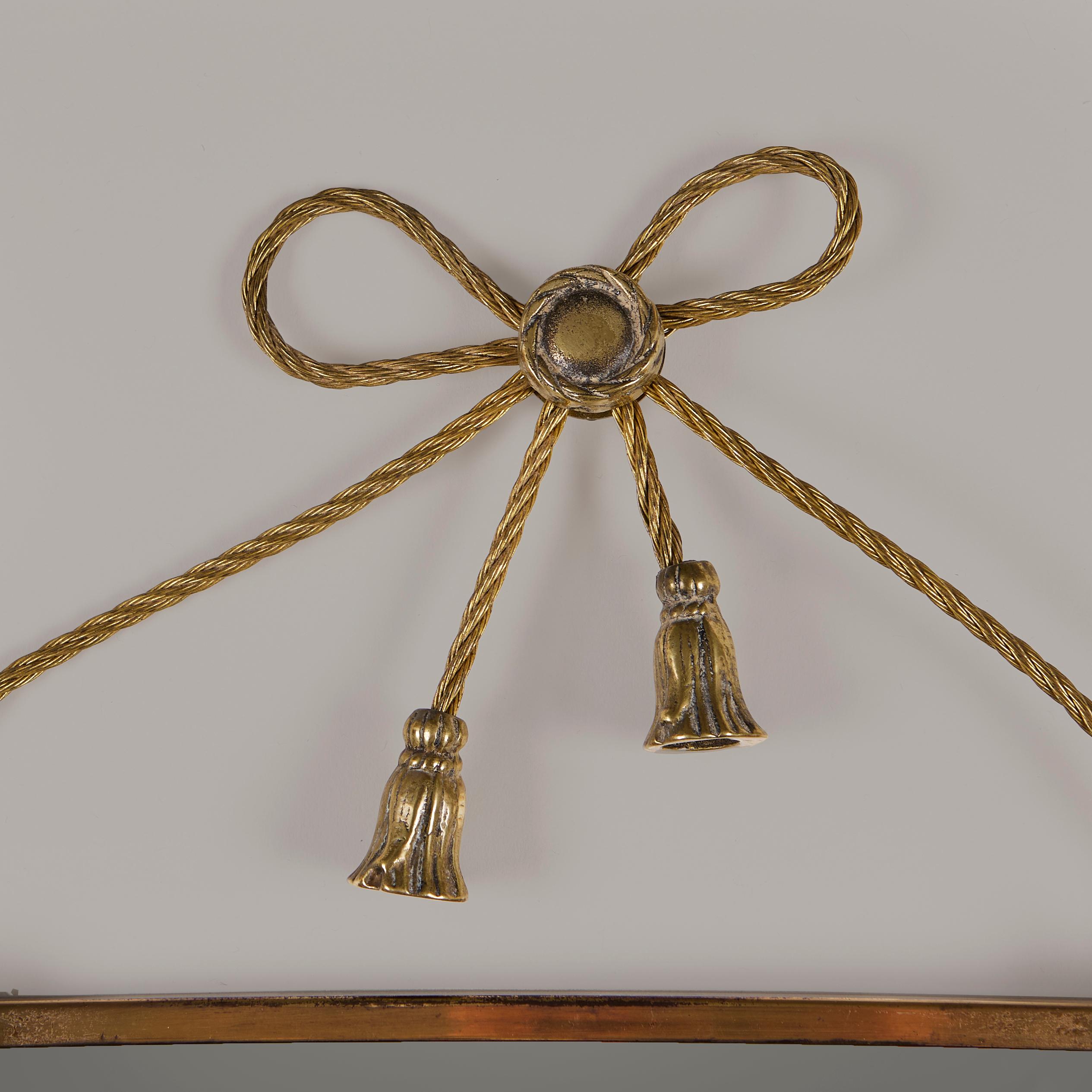 Brass Italian brass bow and tassels mirror. mid-century For Sale
