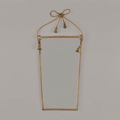 Italian brass bow and tassels mirror. mid-century