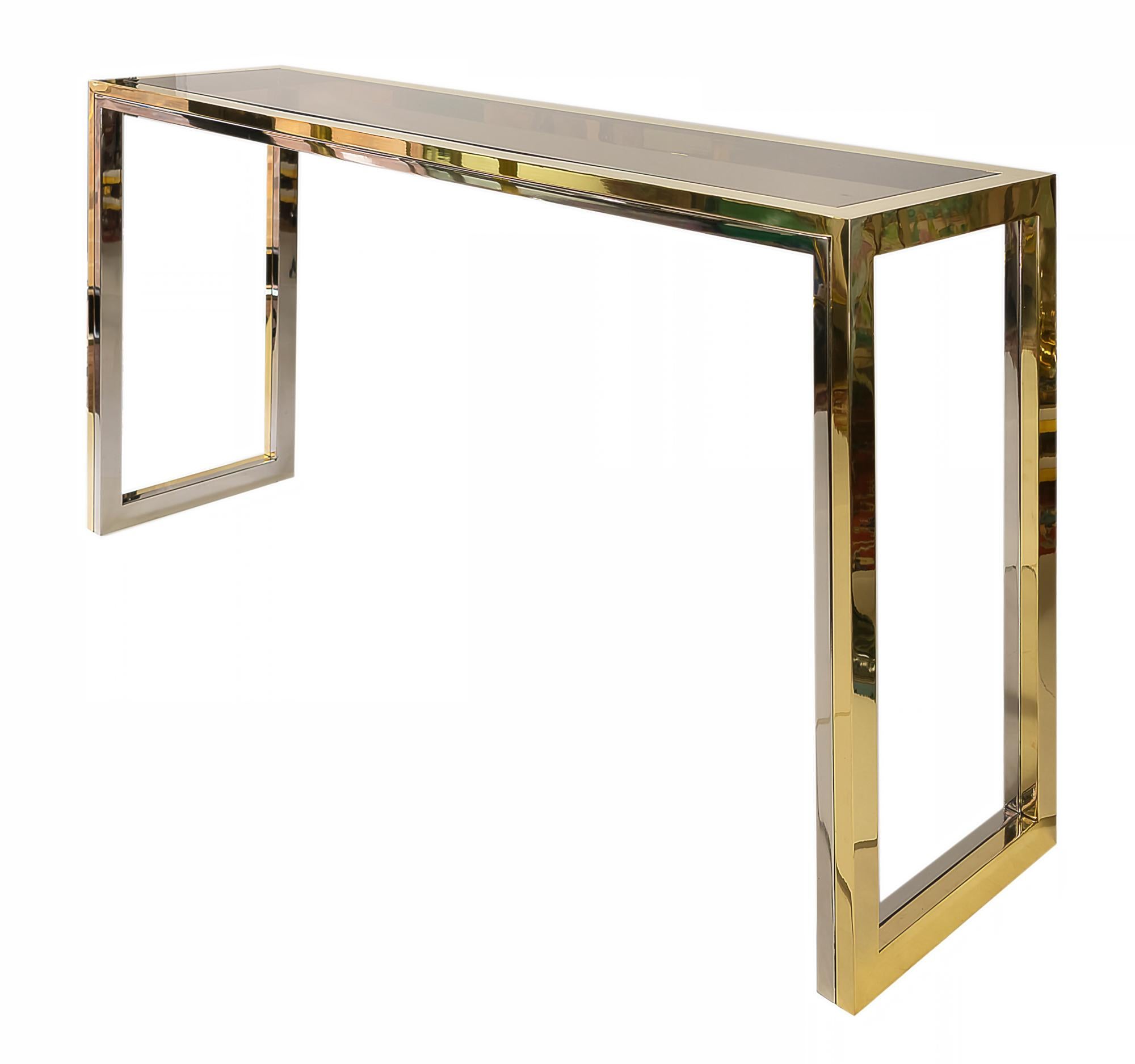 This midcentury Italian console table made of brass and chrome frame with smoked glass top. It is heavy and solid, very good condition (newly polished).