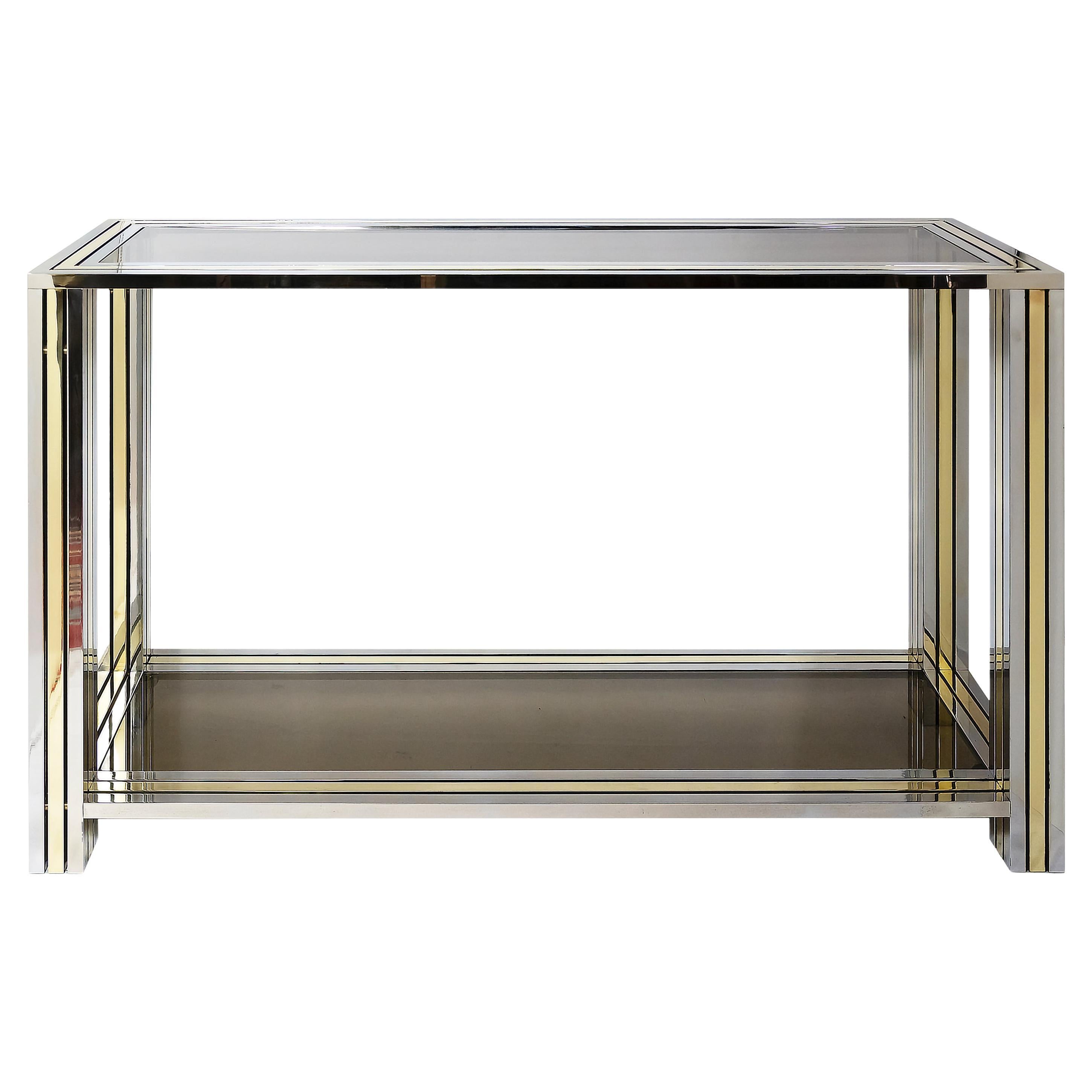 Mid-Century Italian console table made of brass and chrome plated stripes frame with smoky glass top and lower shelve.
It is very heavy and solid, very good condition.