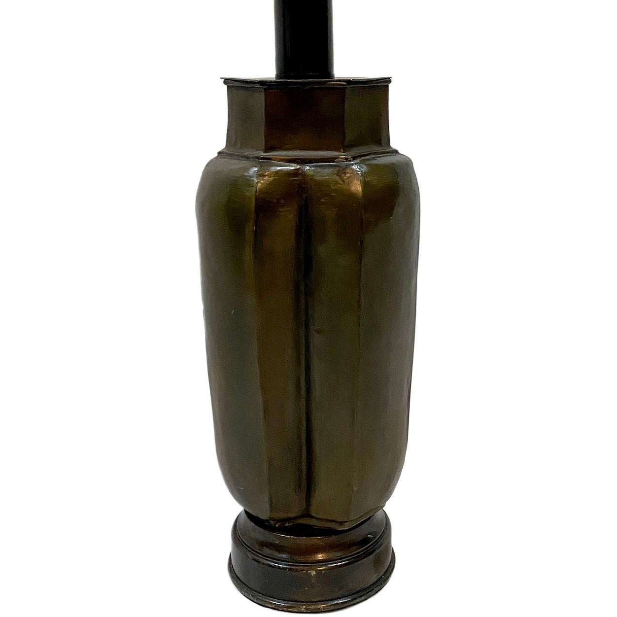 A circa 1950's Italian hammered brass table lamp.

Measurements:
Height of body: 17.5