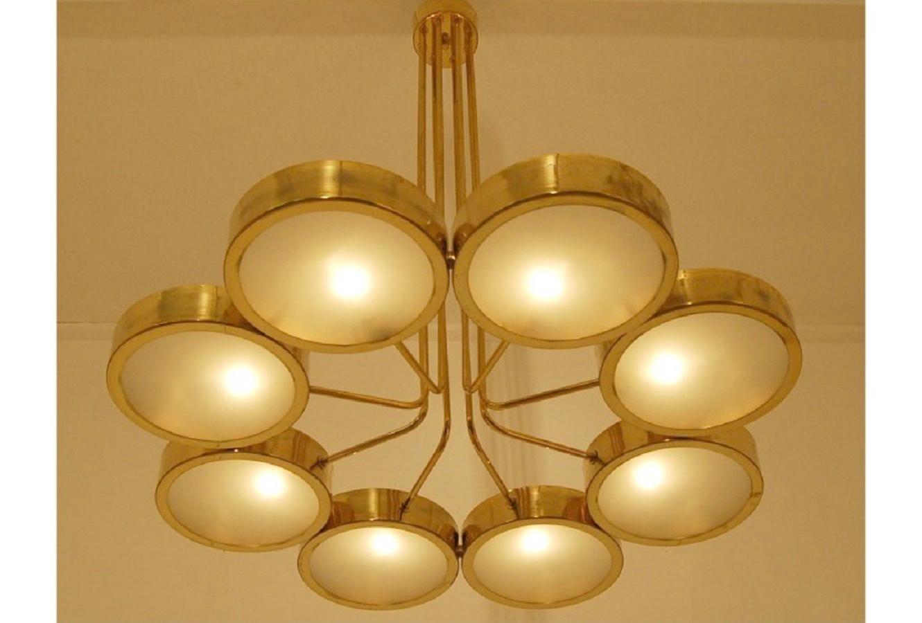 Mid-century Italian brass chandelier with opal glass shades. 8-fold electrification.
The object is constructed like a flower with a stem, the holders of the bowls come 
together from the middle to form a strand.
Very decorative, elegant-casual