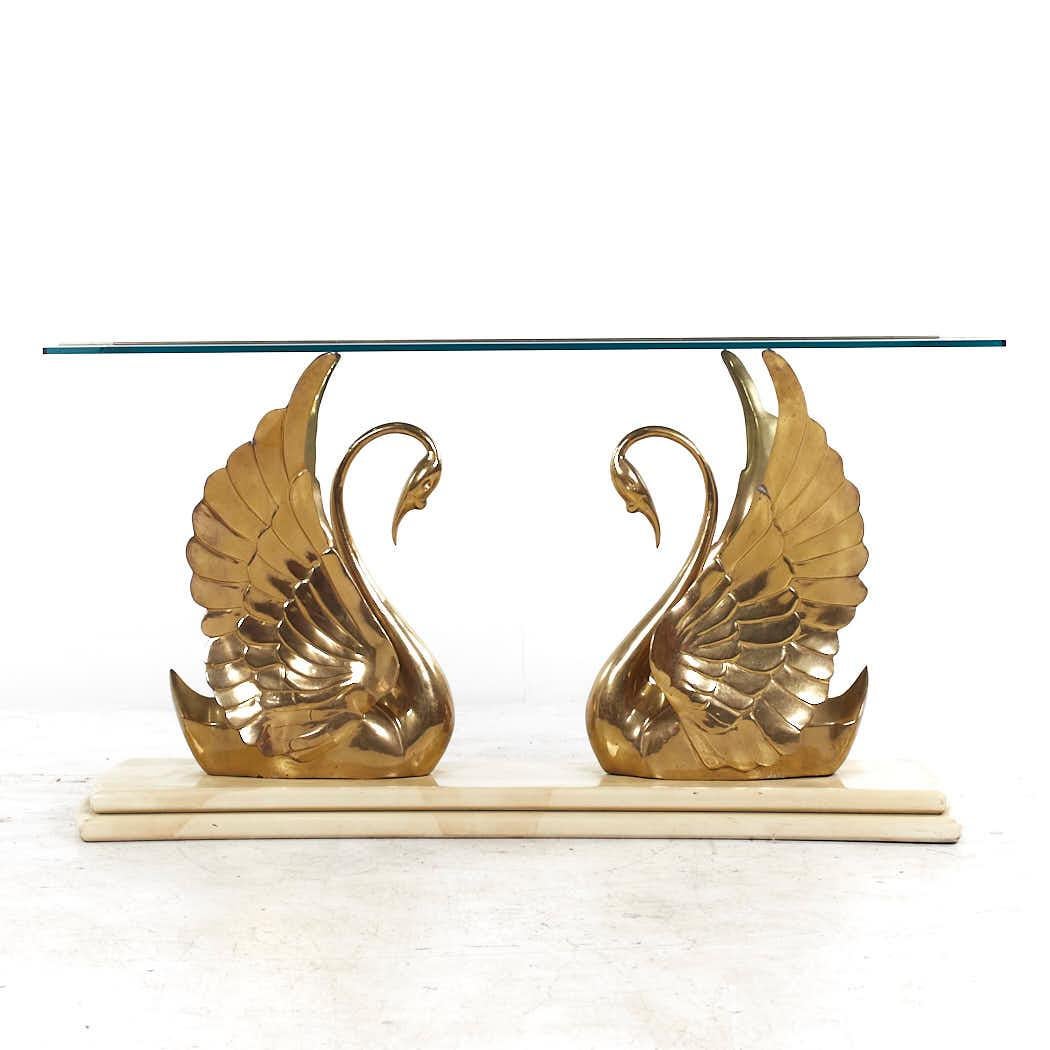 Mid Century Italian Brass Swan Console Table

This console table measures: 59.5 wide x 22 deep x 30.75 inches high

All pieces of furniture can be had in what we call restored vintage condition. That means the piece is restored upon purchase so it’s