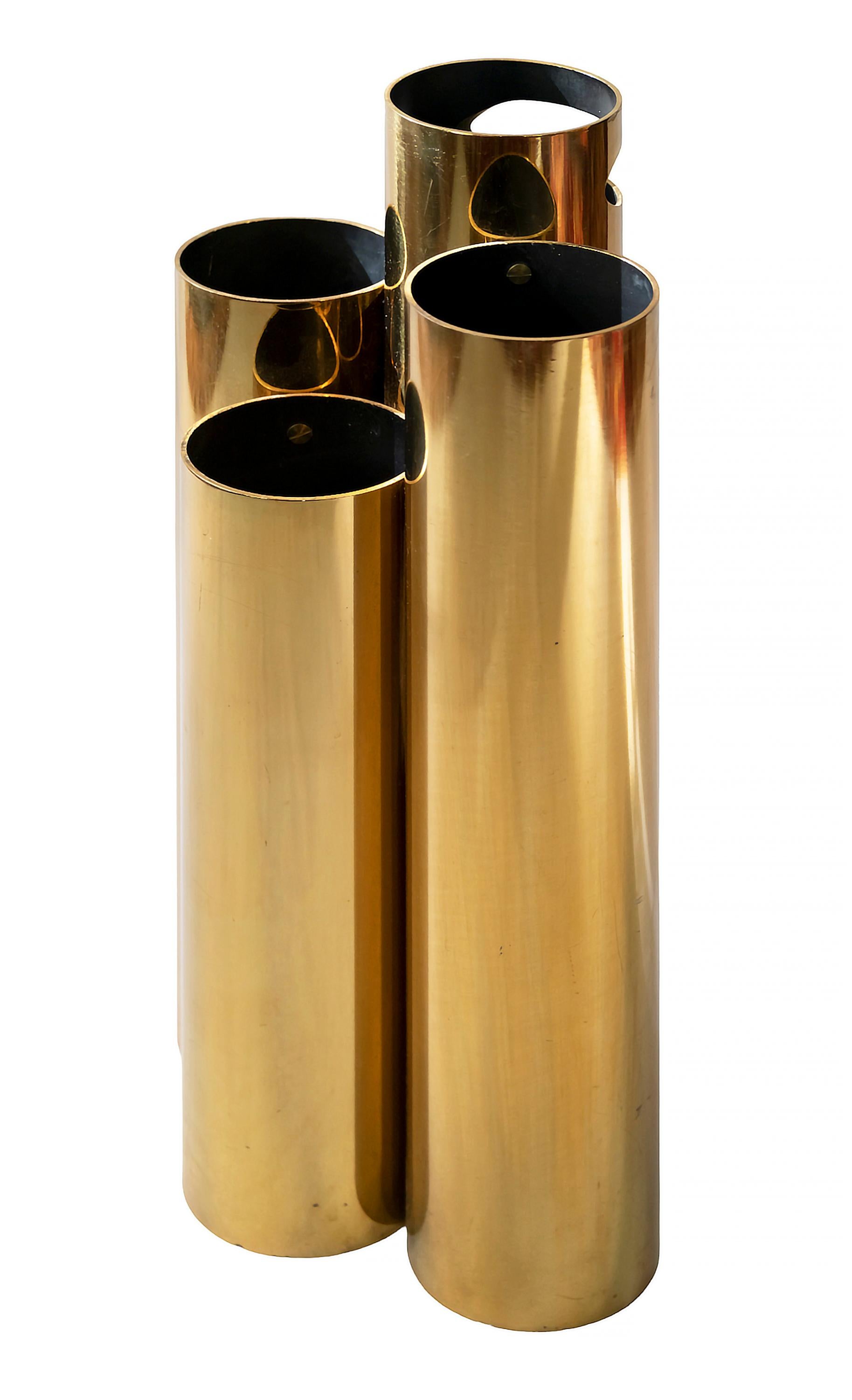 Italian midcentury brass umbrella stand created as a set of four cylinder tubes that are of different height and connected together. The highest tube is with hole cut out as a handle.