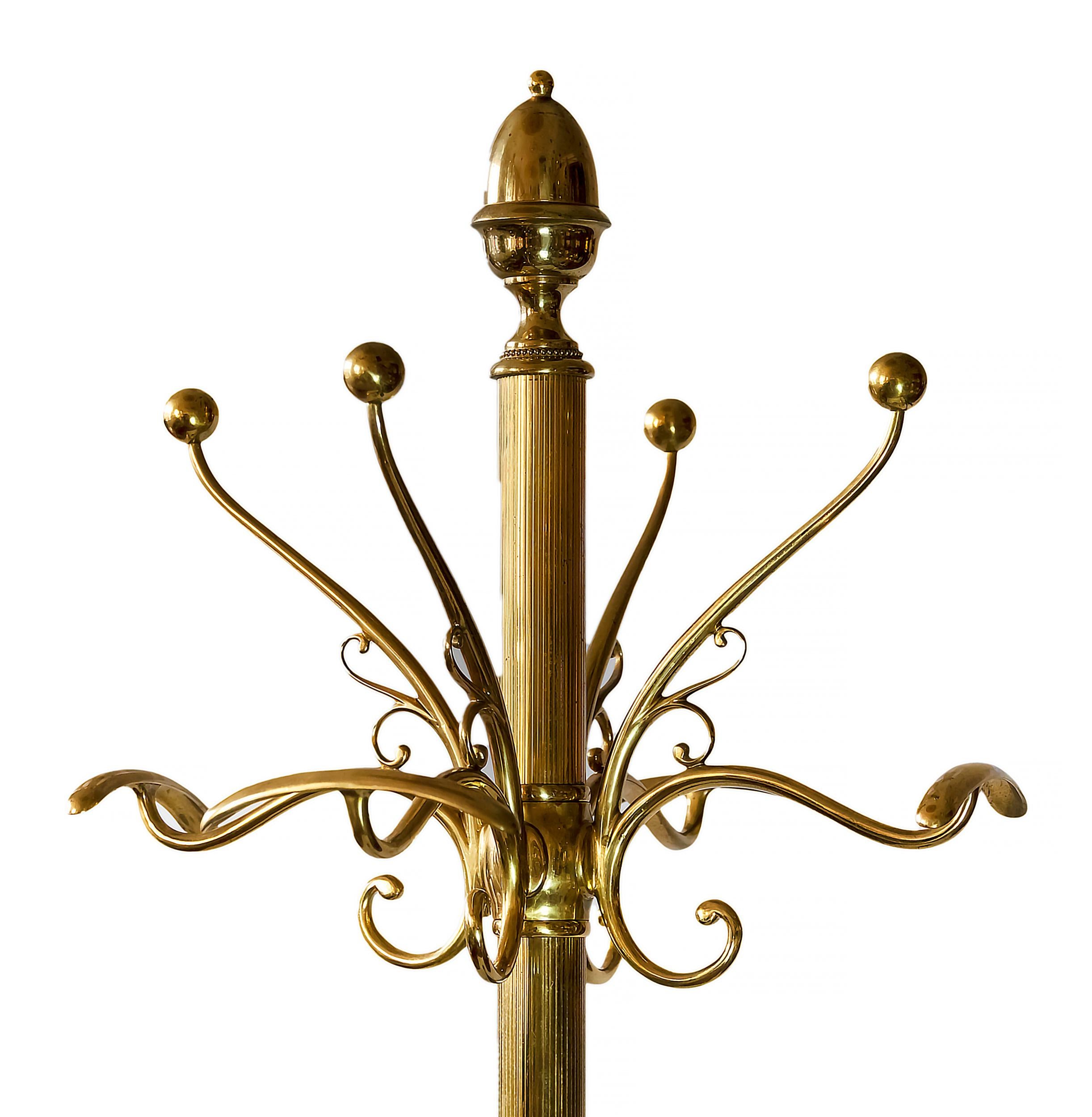 Very high and solid Mid-Century Italian coat rack/stand in bronze with round form black marble base and decorative lion bronze legs.
The weight is 26,6 kg.
 