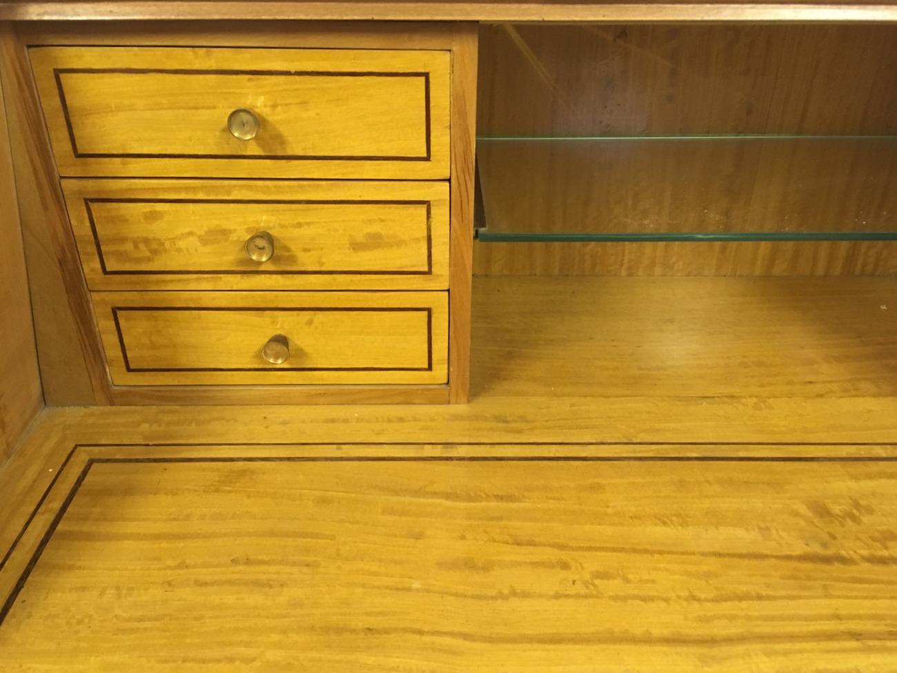 Bureau bookcase or trumeau
By Paolo Buffa and Giovanni Gariboldi
Made by Fratelli Lietti
Mahogany
Brass details
Sycamore writing level and drawers
Swan pediment with brass detail
Italian 
circa 1948.