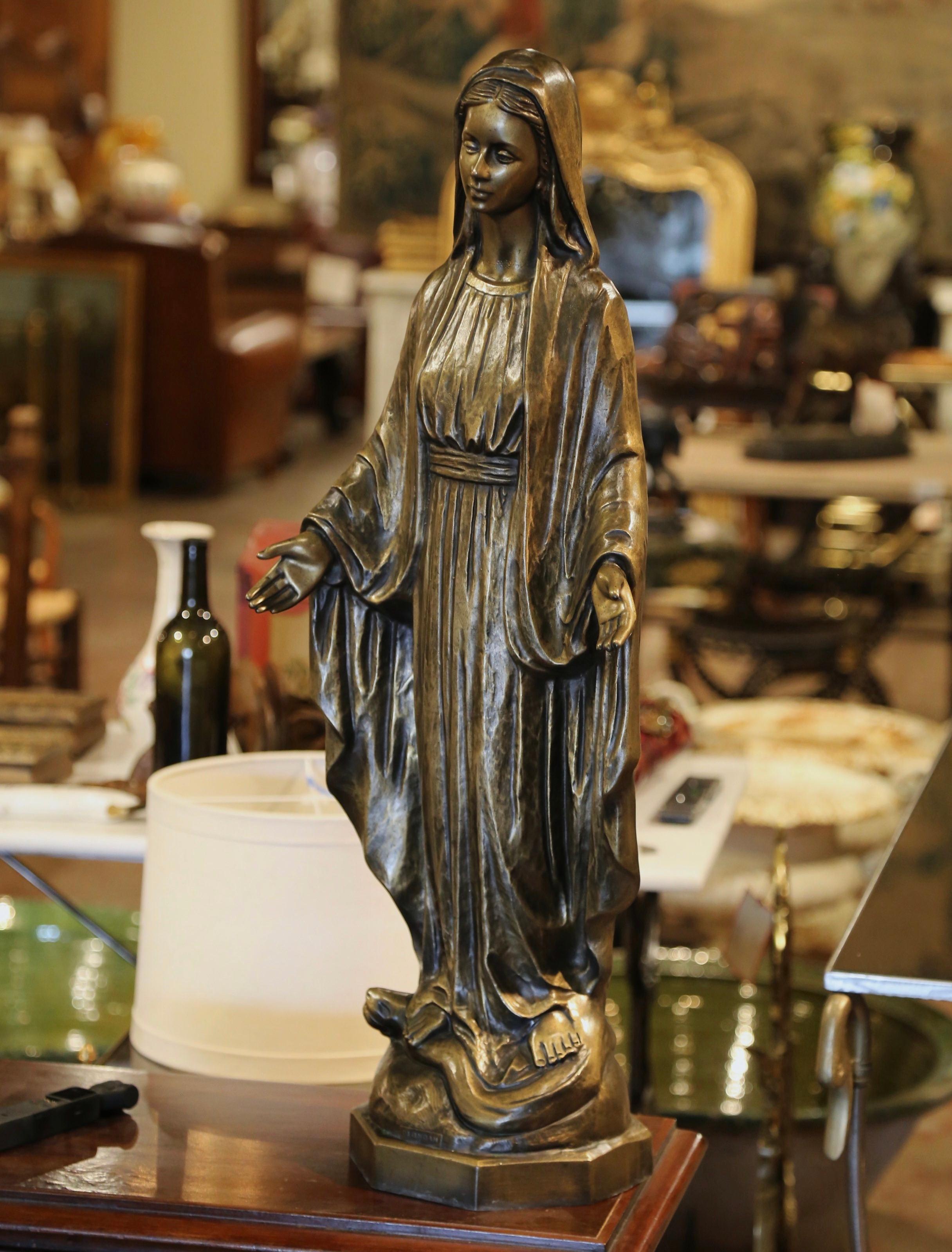 Almost three feet tall, this important antique statue of the Virgin Mary in prayers was created in Italy, circa 1950. Embellished with a patinated gilt finish, the large religious figure is beautifully ornate and has wonderful details throughout her