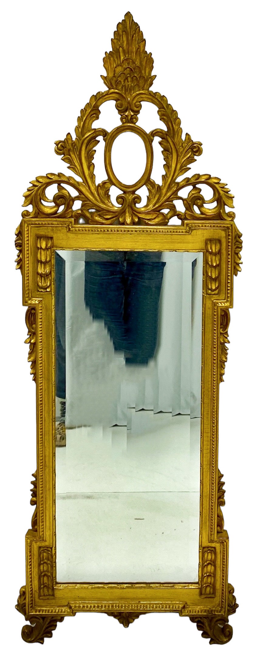 This is that mirror for a tricky wall! It is long and slim. It is an Italian carved giltwood heavily carved mirror with French styling. It is unmarked and in very good condition.

My shipping is running two to five weeks. Local pick up is by