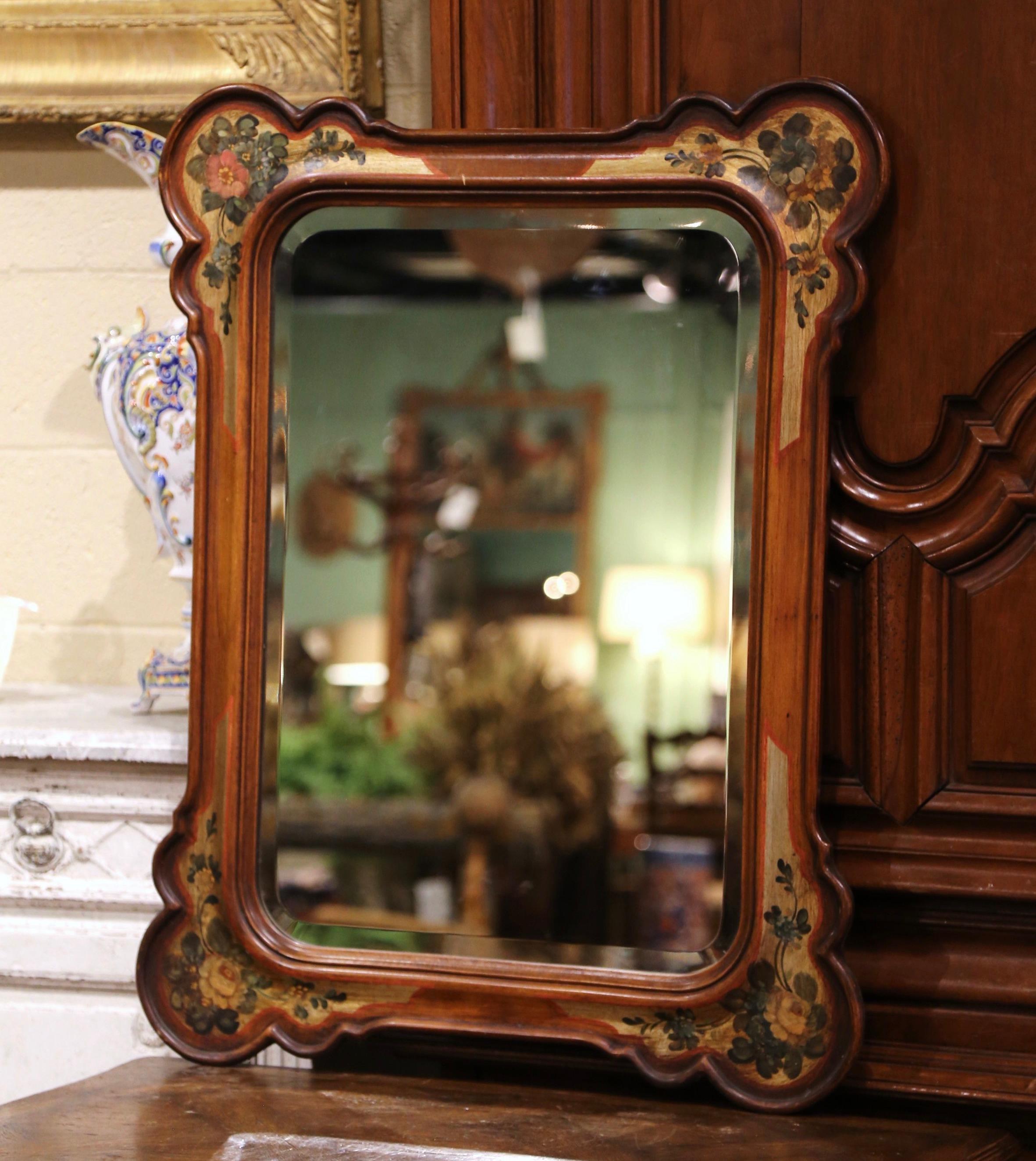 Decorate a powder room or a girl's bedroom with this elegant antique mirror. Crafted in Italy circa 1970 and rectangular in shape with rounded corners, the colorful carved mirror features a scrolled molding around the frame. The frame is embellished
