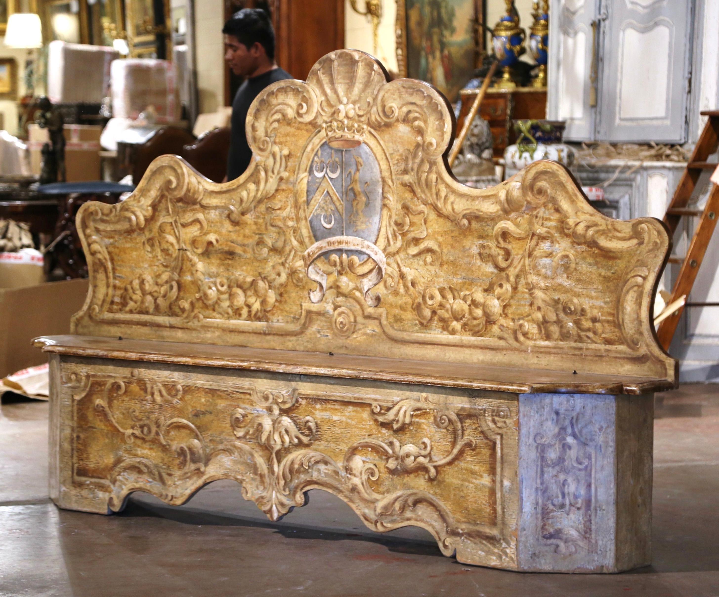 Add Italian visual drama into your home with this elegant and colorful Cassapanca bench. Crafted in Italy, circa 1960, the carved bench features a tall back and apron decorated with intricately scalloped edges. The seating is further embellished