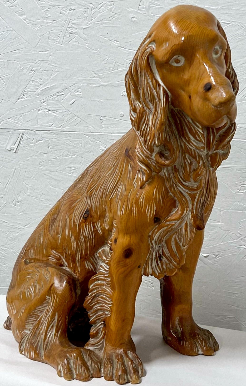 The holidays are upon us! This is a fun carved pine seated Spaniel dog. The piece is believed to be Italian and is in very good condition. It is unmarked. 