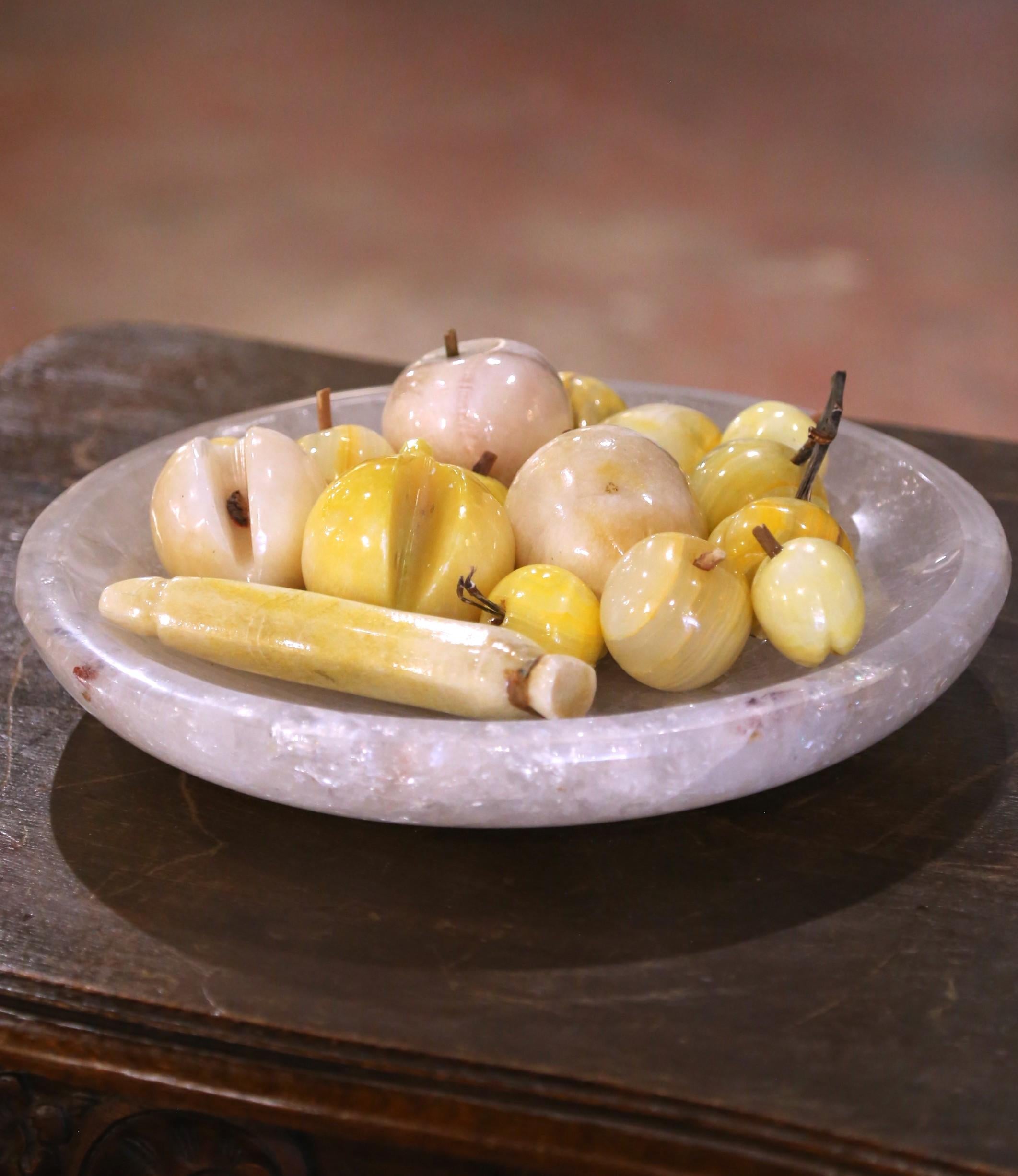 Add a touch of timeless charm to your home with this set of sixteen carved stone fruits, perfect for styling an entryway console, dining room table, or kitchen counter. Crafted in Italy circa 1960, this vintage collection features an artful