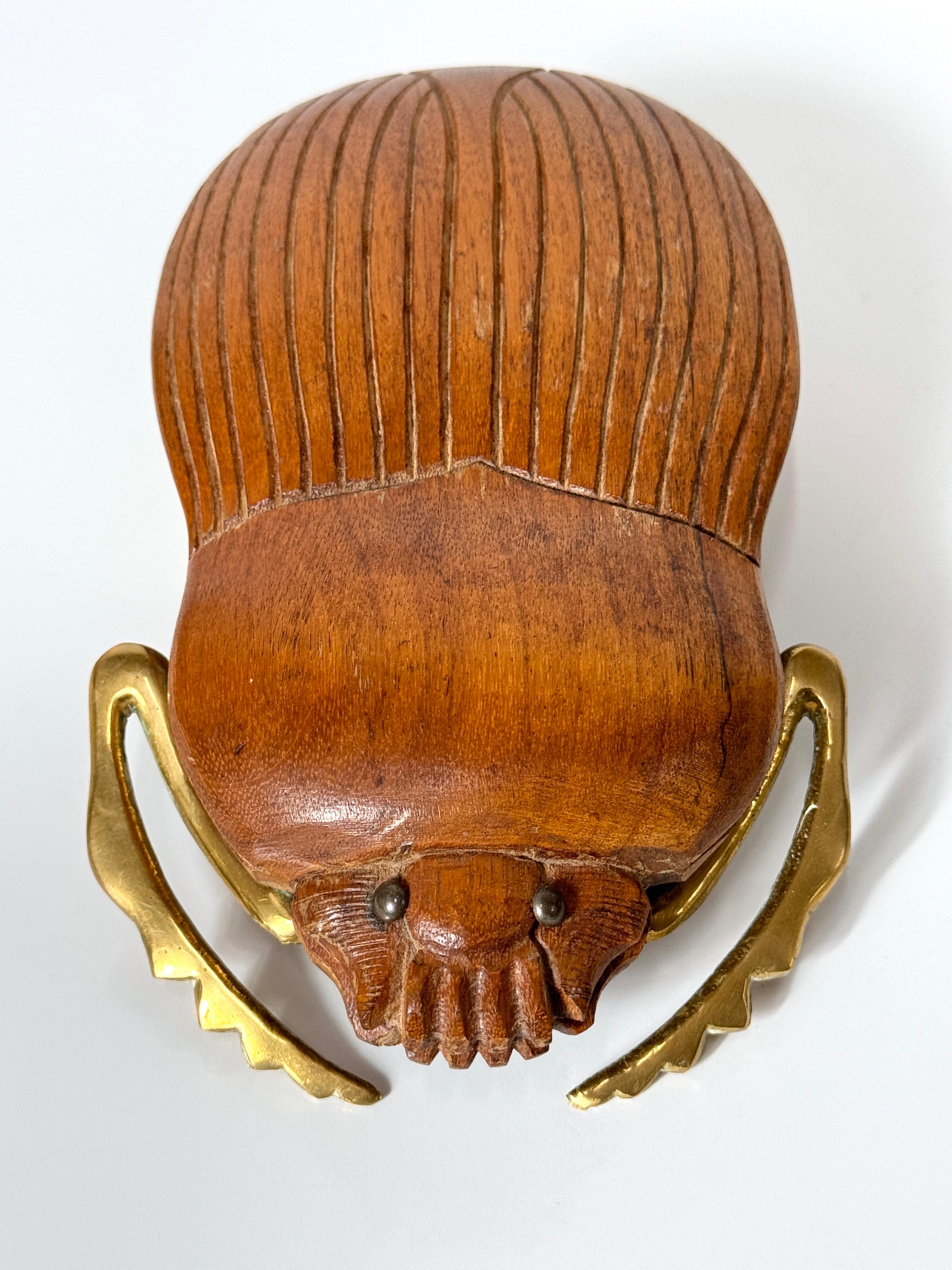 Sarreid LTD beetle sculpture circa 1970s

Solid wood carved scarab with incised detailing and solid brass legs with original patina

Complimenting tortoise sculpture shown in photos is available listed separately

8 inch width
5 inch depth
2.5 inch