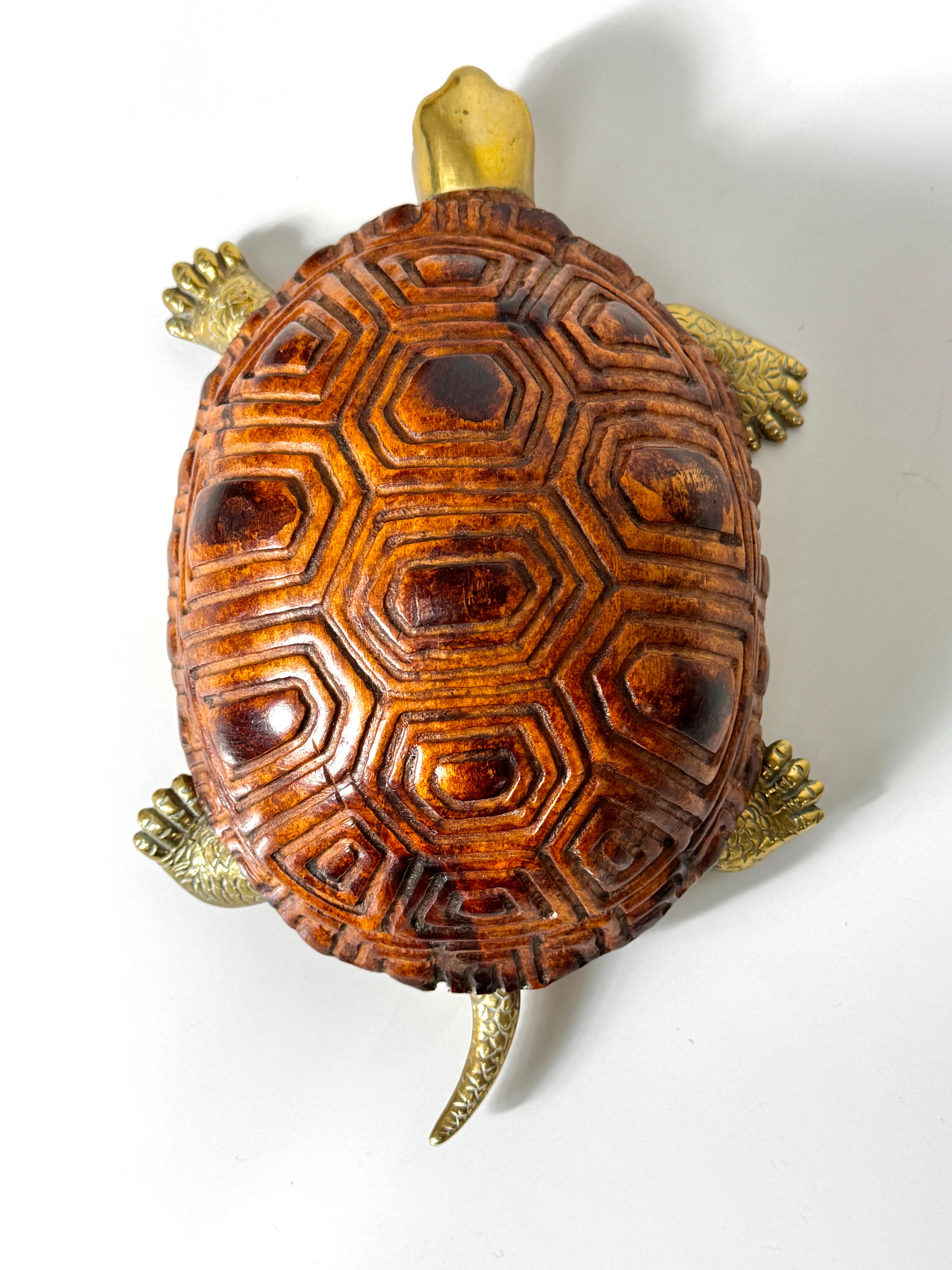 Sarreid LTD turtle or tortoise sculpture circa 1970s

Solid exotic wood shell is carved and finished with lifelike detail 
Head feet and tail in solid brass with original patina

Complimenting scarab sculpture shown in photos is available listed