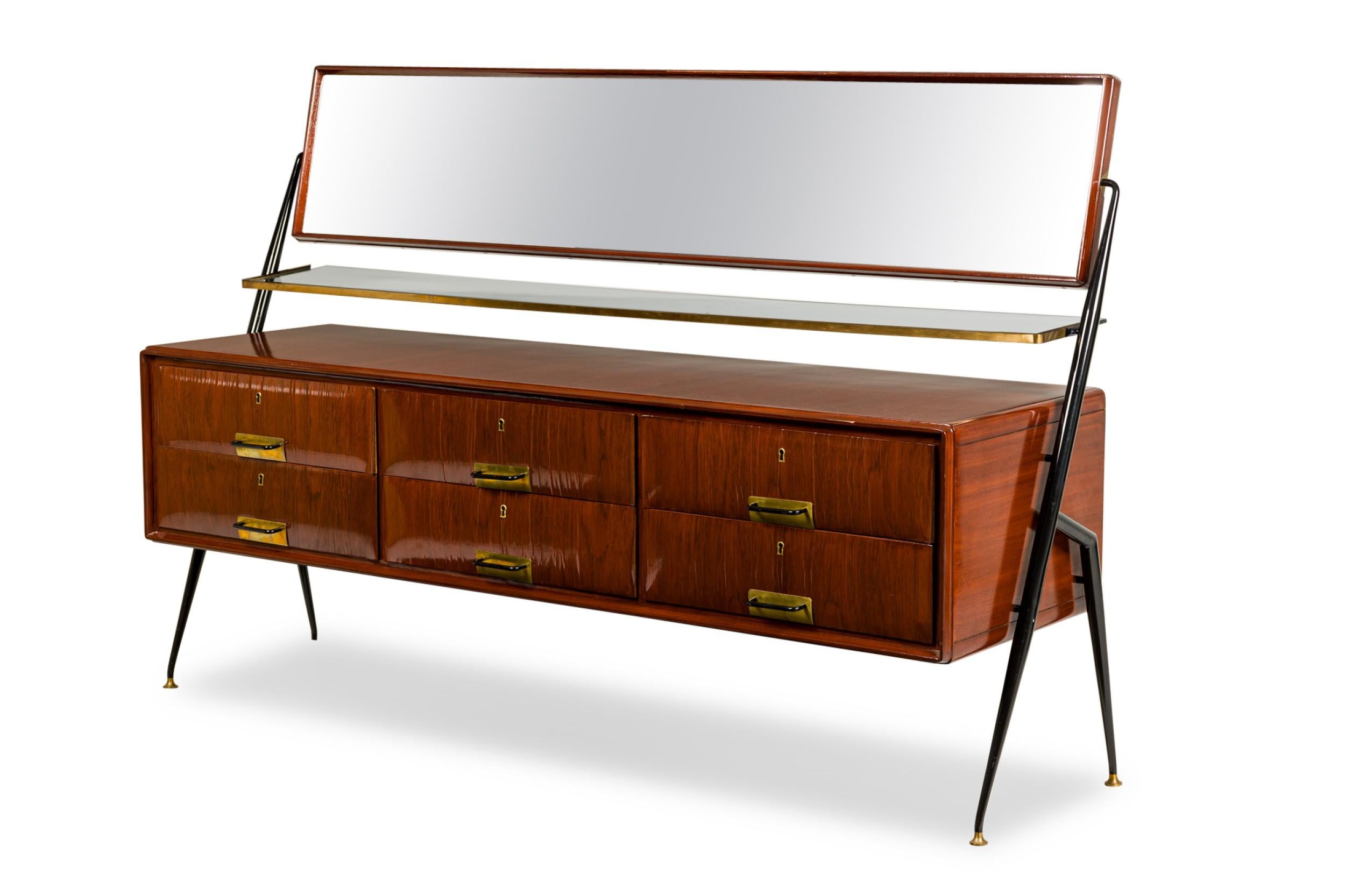 Italian 1960s mahogany chest with 6 drawers having a glass shelf under a swivel horizontal bevelled glass mirror supported by ebonized metal side supports (SILVIO CAVATORTA)

Condition: Good; Wear consistent with age and use