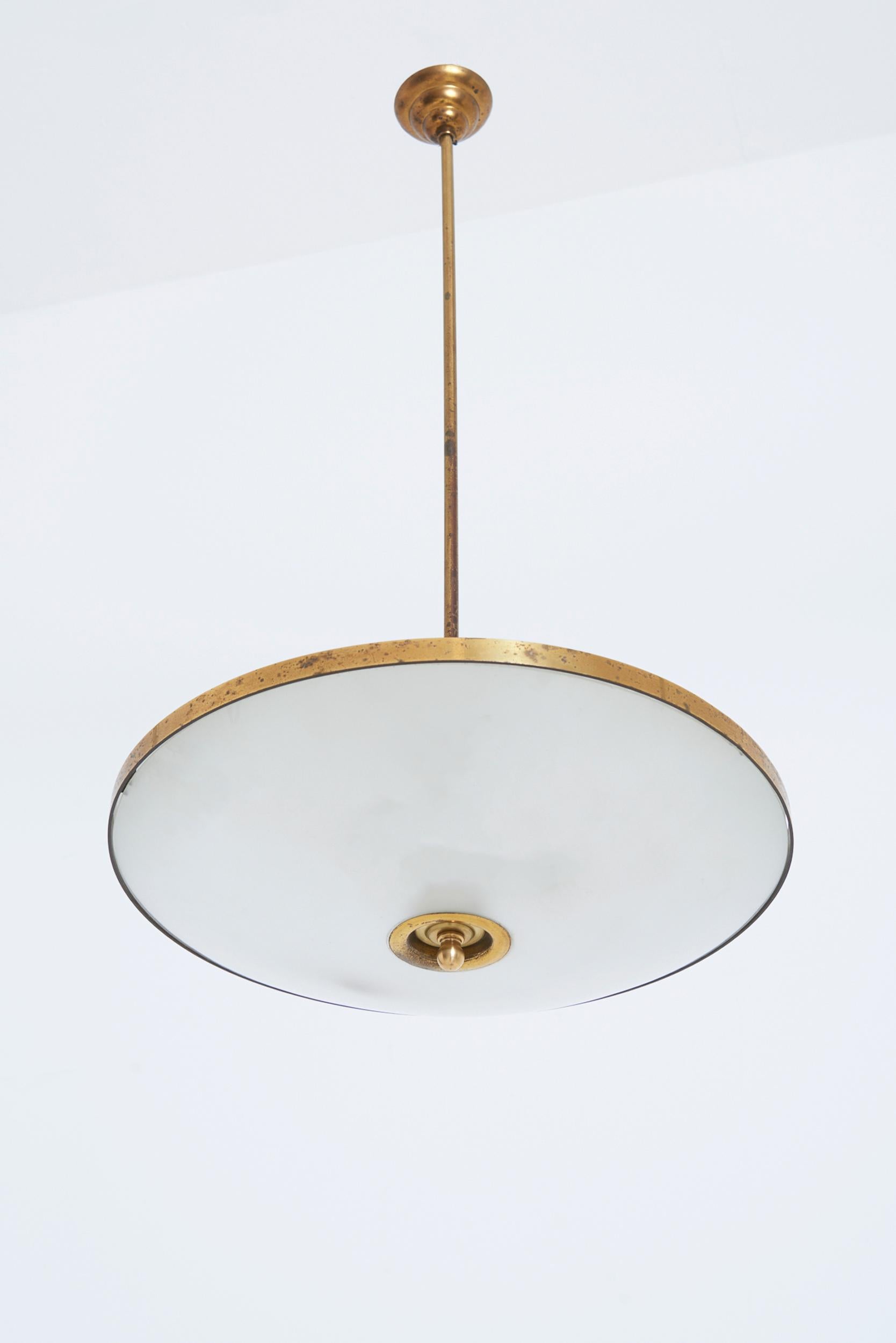 A glass and brass ceiling light
Italy, 1950s
