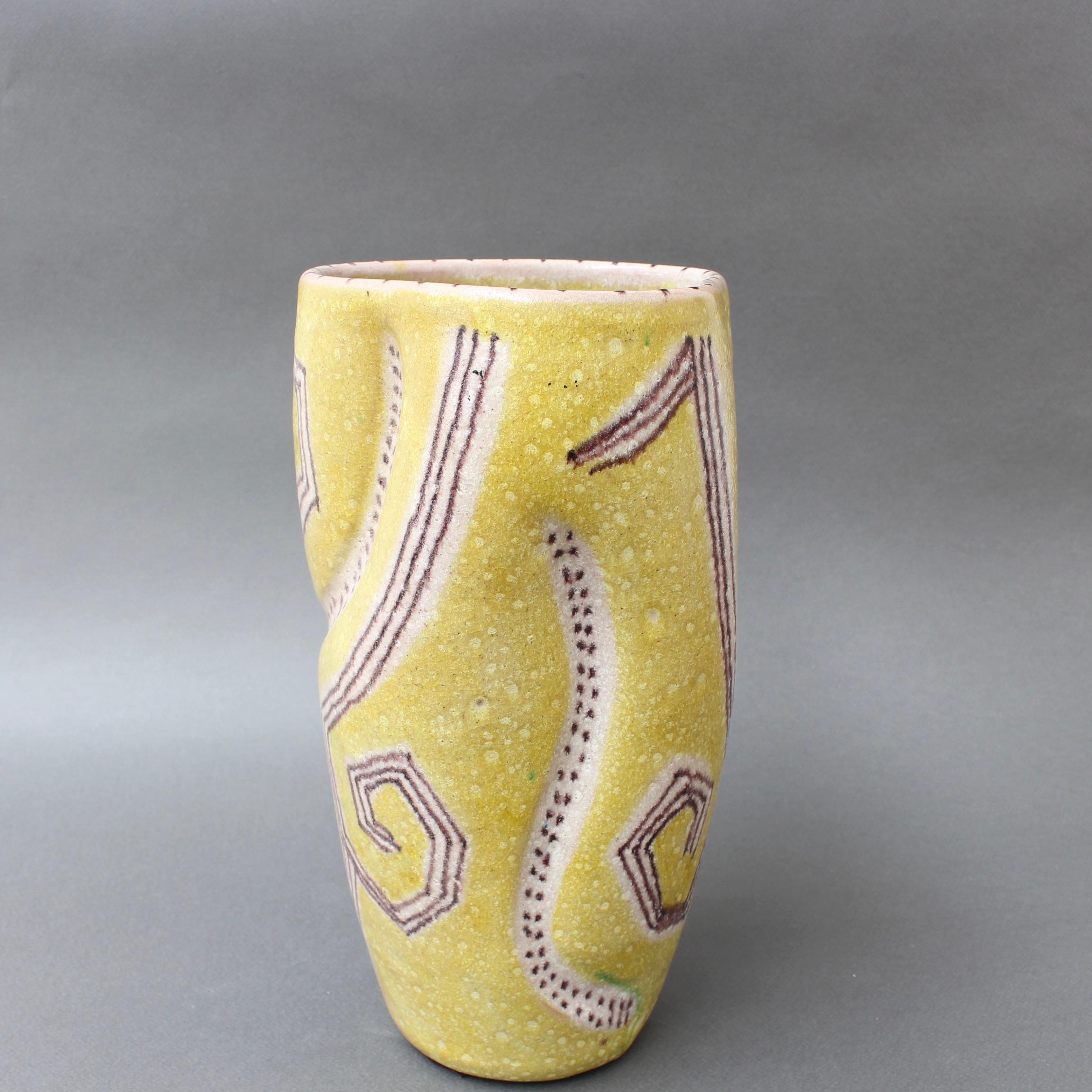 Midcentury Italian ceramic vase with abstract motif by Guido Gambone (circa 1950s). A stunning piece of extraordinary artistry, this is hand painted in a yellow cadmium glaze with brown abstract highlights composed of lines, spots and stripes. Its