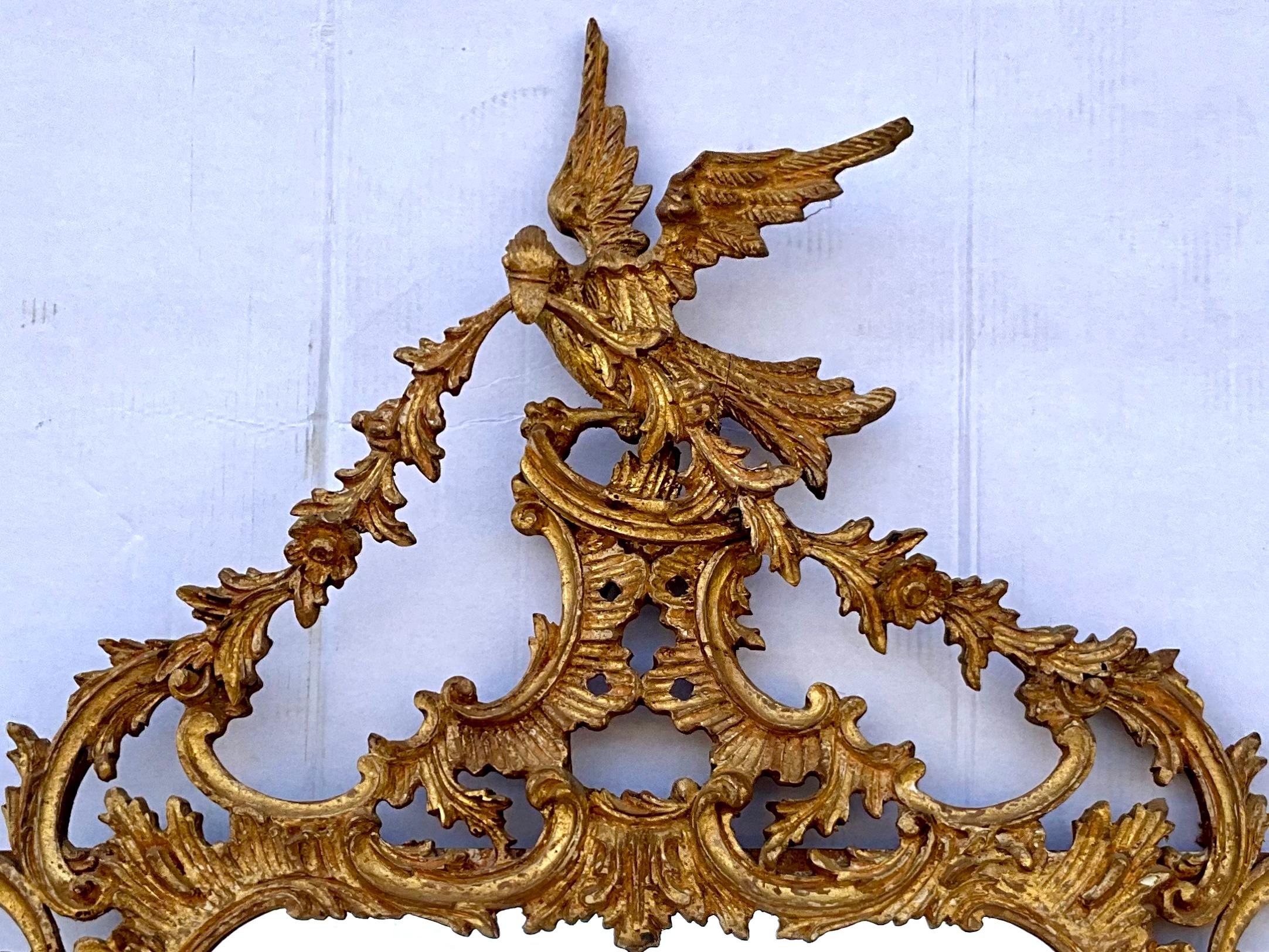 Timeless elegance! This is an Italian carved giltwood Chinese Chippendale style mirror in very good condition. It has an Italian label and may be by Friedman Brothers.