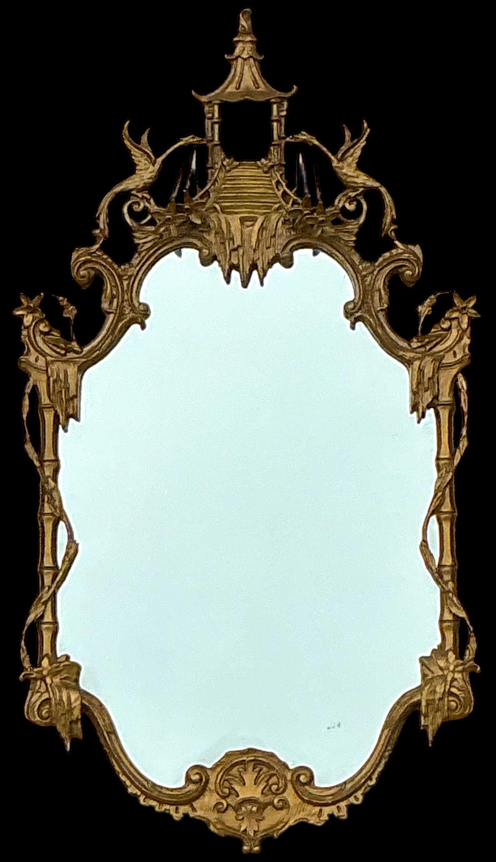This is a 1960s Italian Chinese Chippendale style carved giltwood and cast terracotta mirror.  The pagoda is flanked by facing hoho birds.  The piece is unmarked and in very good condition. 

Shipping can run two to five weeks. 