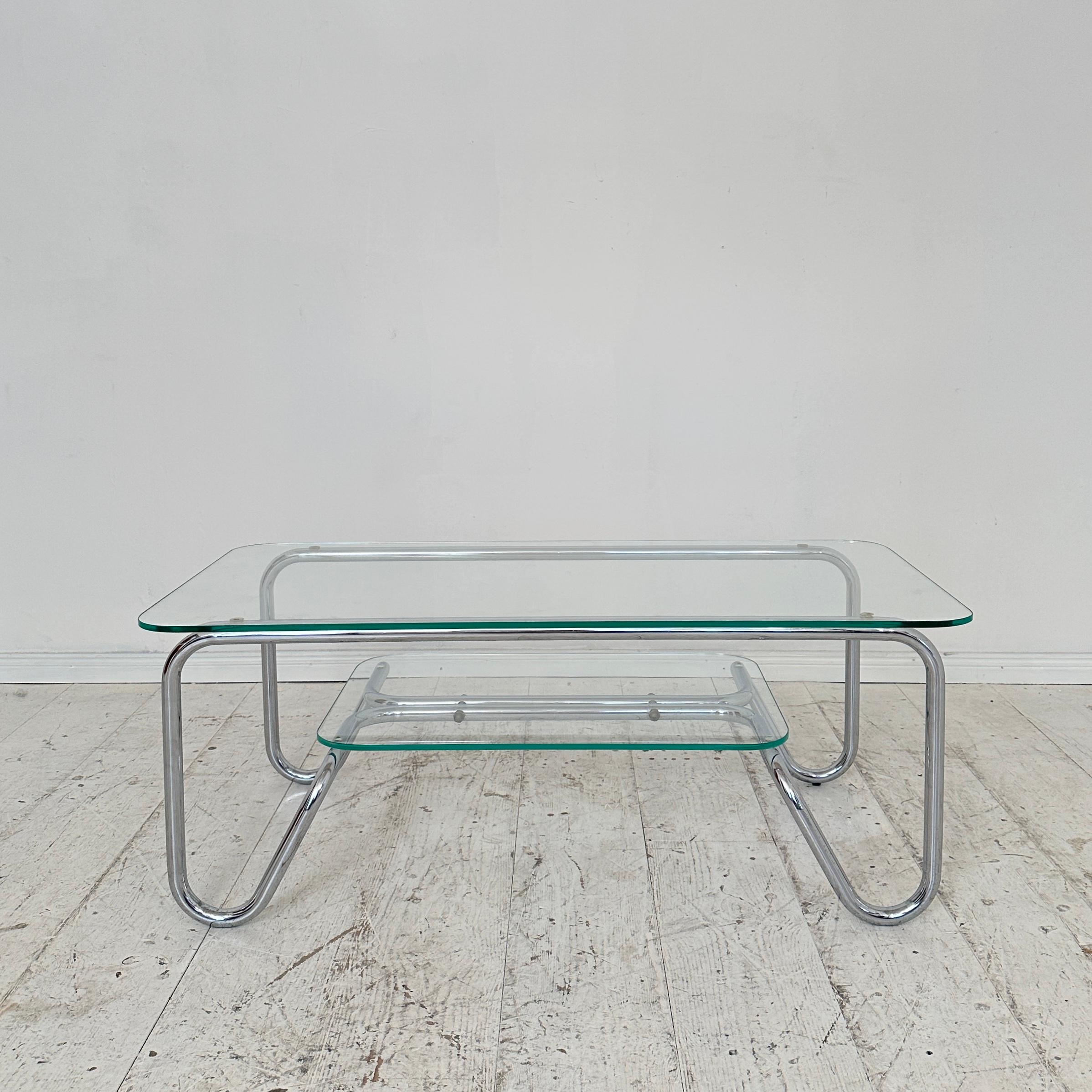 Crafted in 1970, this Mid Century Italian Chrome Coffee Table epitomizes the sleek sophistication of Bauhaus design. The marriage of chrome and glass embodies the ethos of form following function, characteristic of the movement. With clean lines and