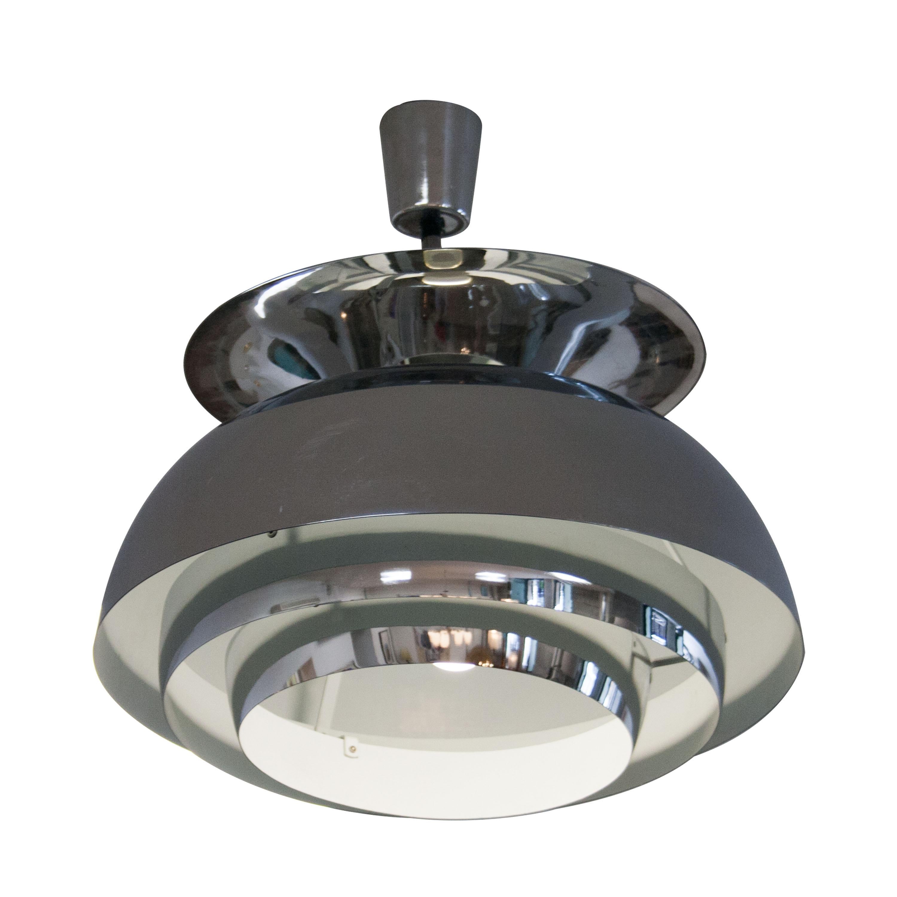 Italian chromed ceiling lamp. Made of chromed steel with white lacquered interior. One light point.