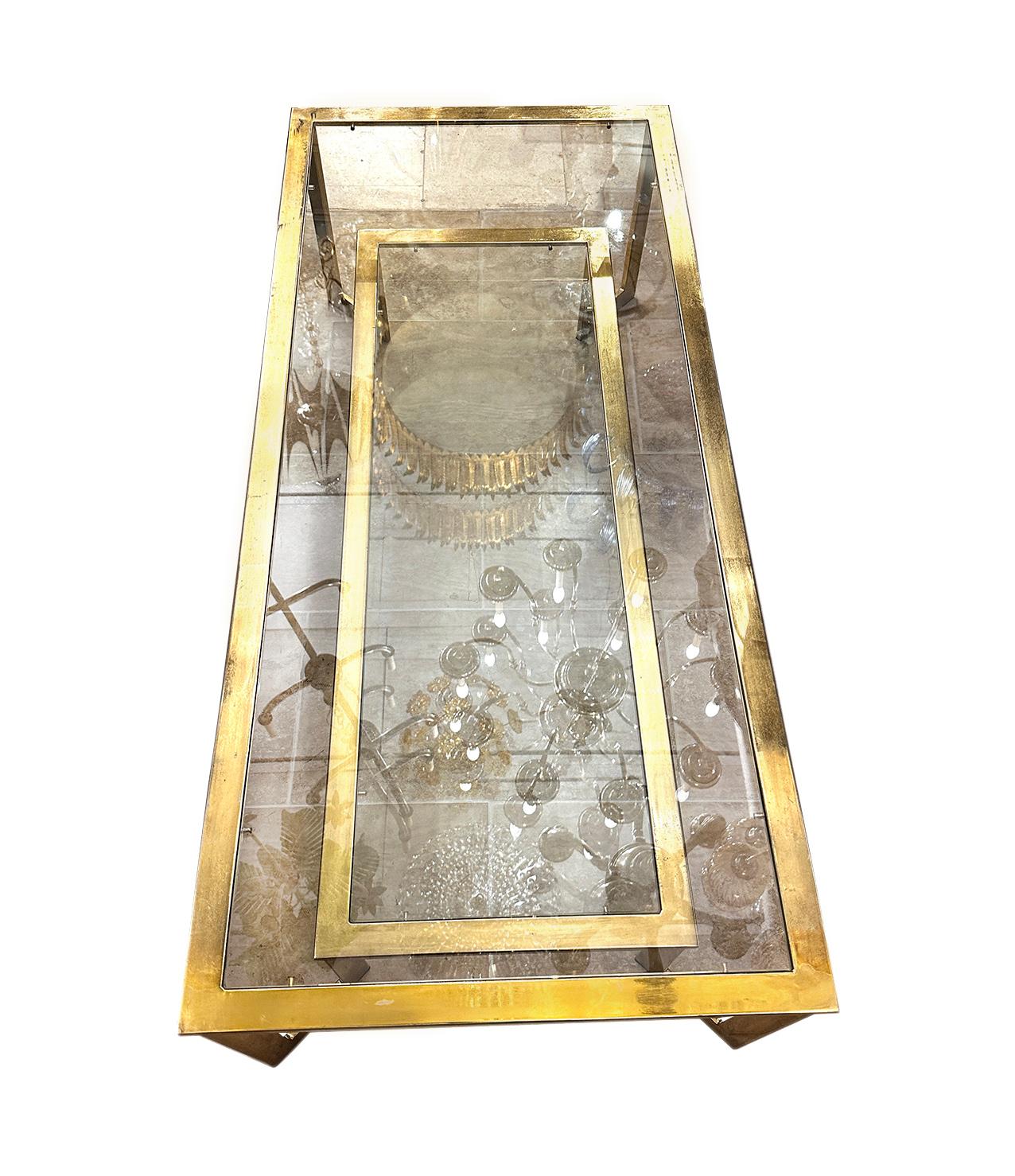 A circa 1960s Italian coffee table with 2 levels of glass.

Measurements:
Height: 15.5