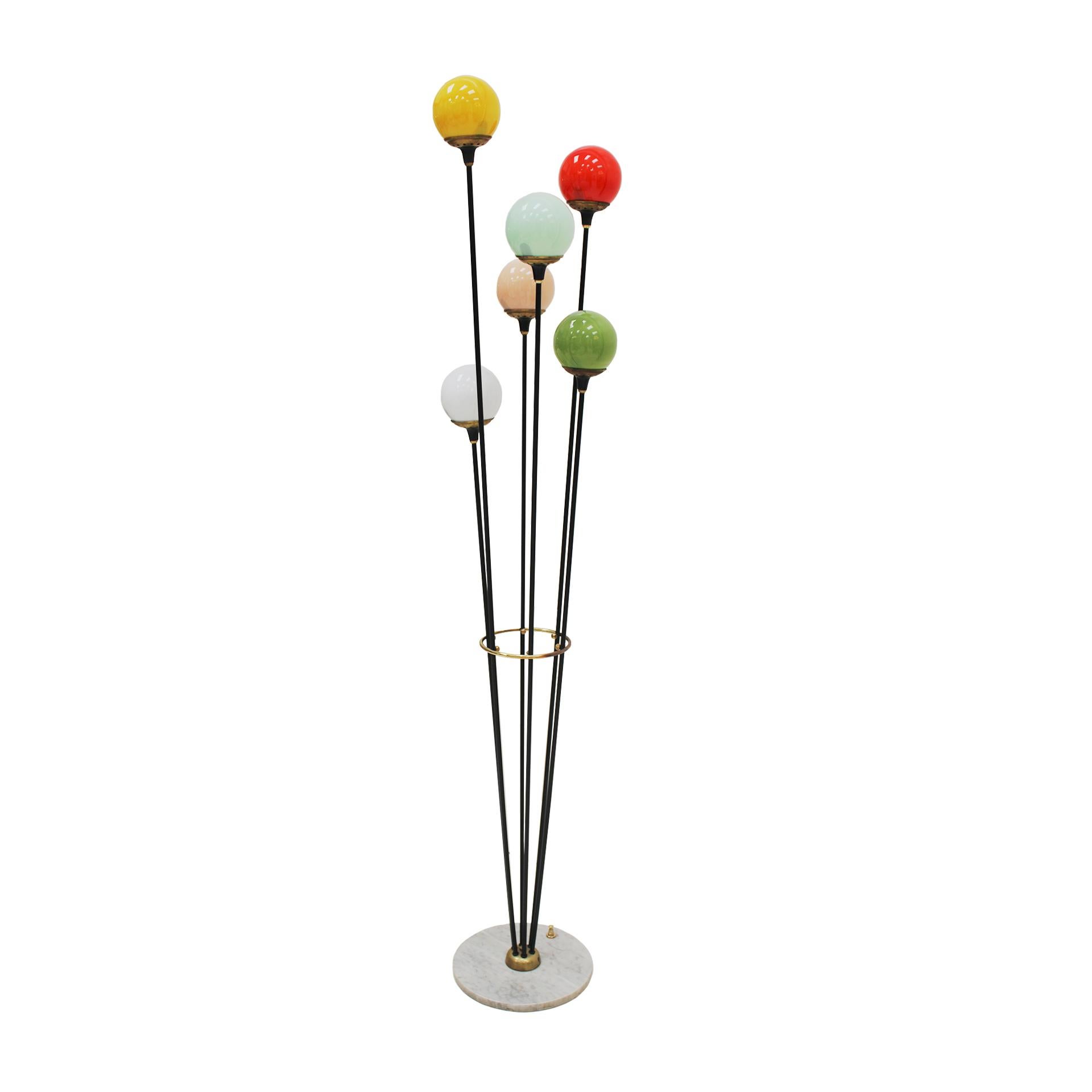 Floor lamp designed by Stilnovo, composed of six light points. Structure made of black lacquered iron with brass finishes, coloured matt sphere glass shades (in 6 different colours) and white round marble base with switch. Italy, 1950s.