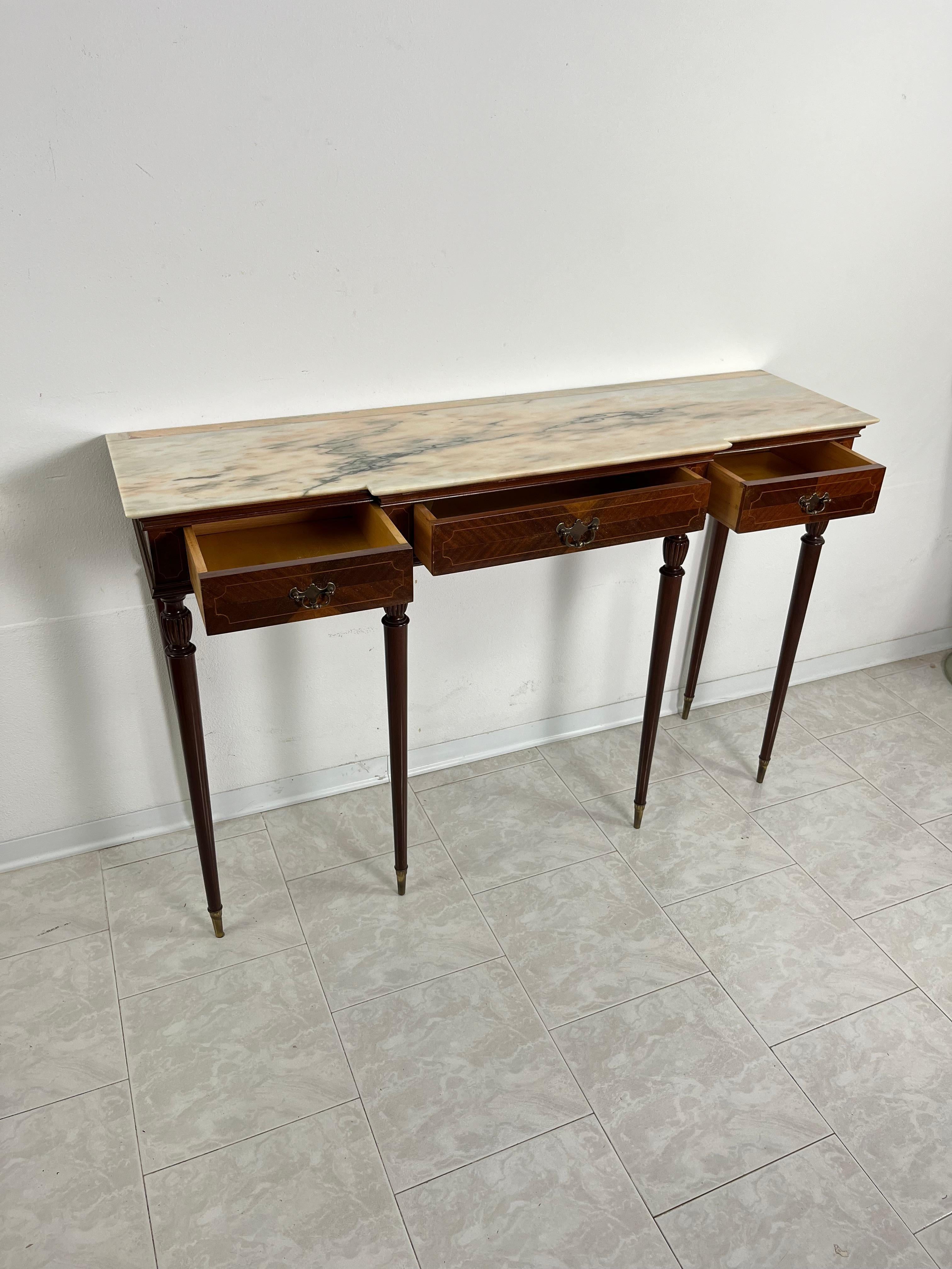 Mid-Century Italian console in wood, marble and brass 1950s
Three drawers on the front, marble top. Brass terminals.
Good conditions.