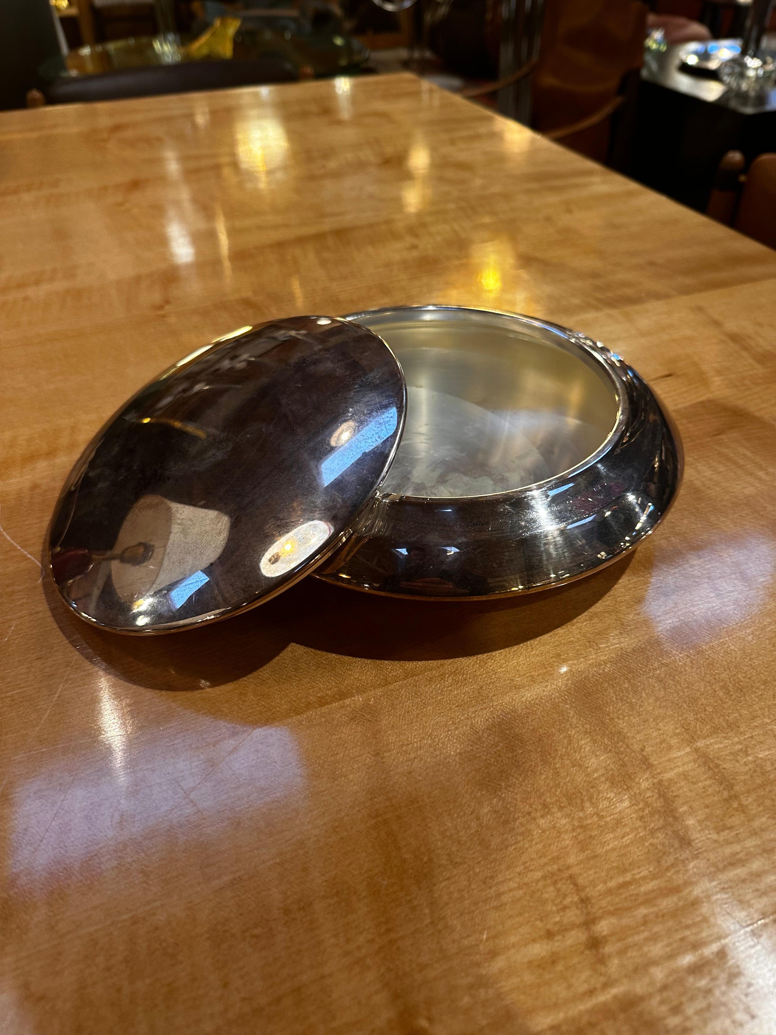 A Mid-Century Italian Decorative Center Bowl from the 1960s is a stylish and iconic piece featuring the design characteristics of that era. Crafted with a blend of form and function, this bowl likely showcases clean lines, organic shapes, and a