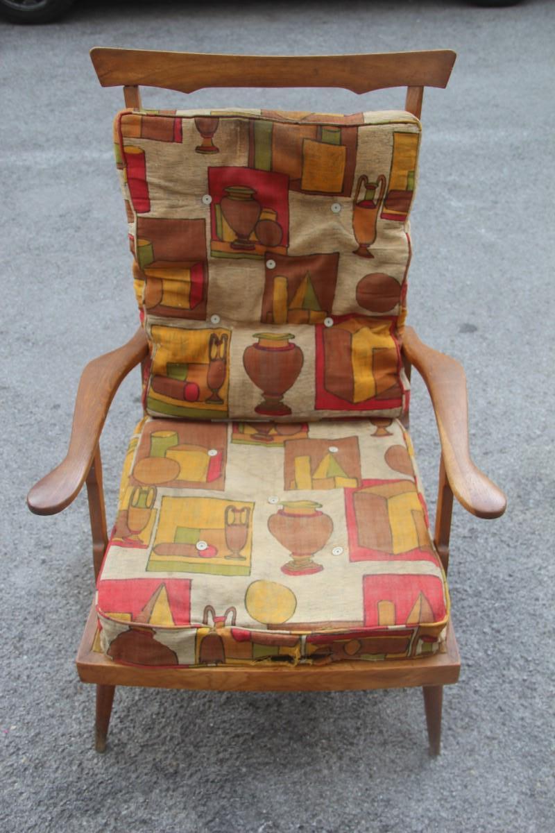 Midcentury Italian design reclining chestnut armchair 1950s shaped wood.

Original fabric but unfortunately to be replaced, Armchair marked by fire 'Camea' Modello Brevettato.
Remember the Style Paolo Buffa design.