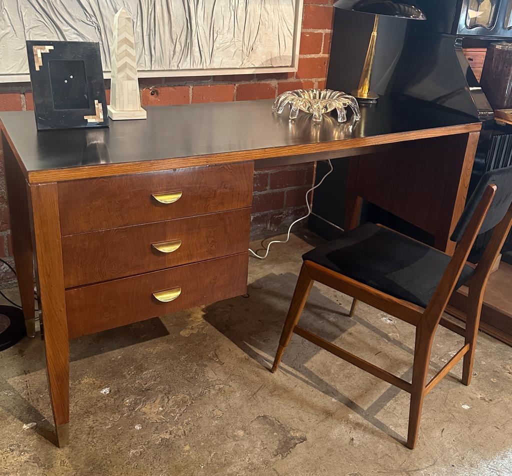 Extraordinary and elegant mid century desk by Gio ponti manufactured by I.S.A. Italy 1957. Designed for Fondazione Garzanti.
The desk is made from Solid has-wood , laminated top brass handles. It's an incredible piece that will stand with the time.