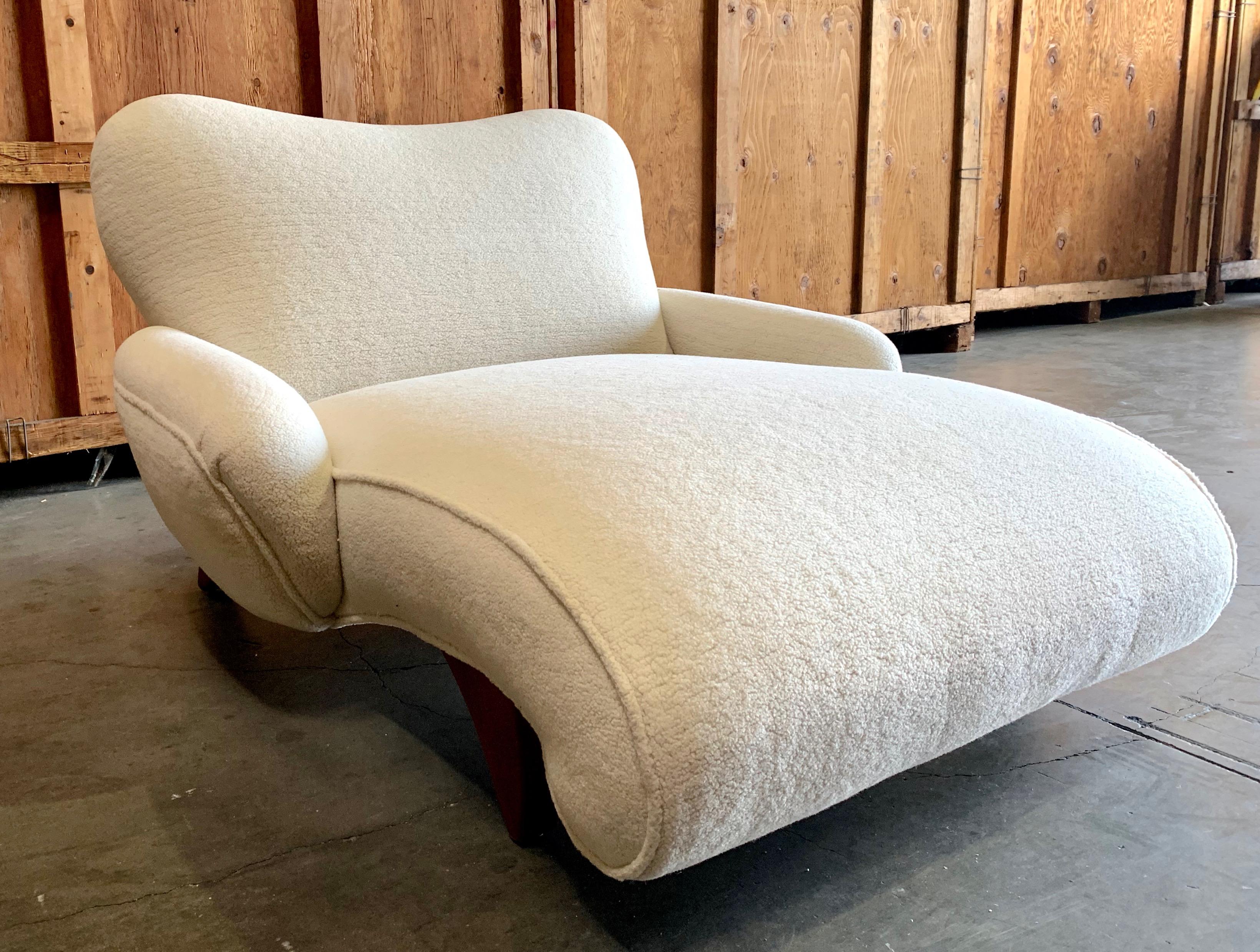 Whimsical early 20th century Italian chaise newly reupholstered in short sheepskin with monochromatic edge detailing.